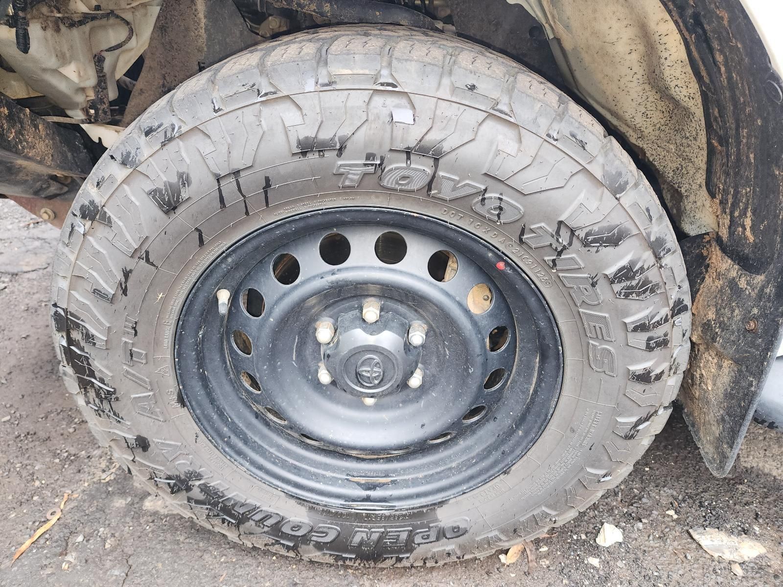 Muddy Off-road Tire on a Steel Rim — South West 4WD Wreckers In Harristown, QLD