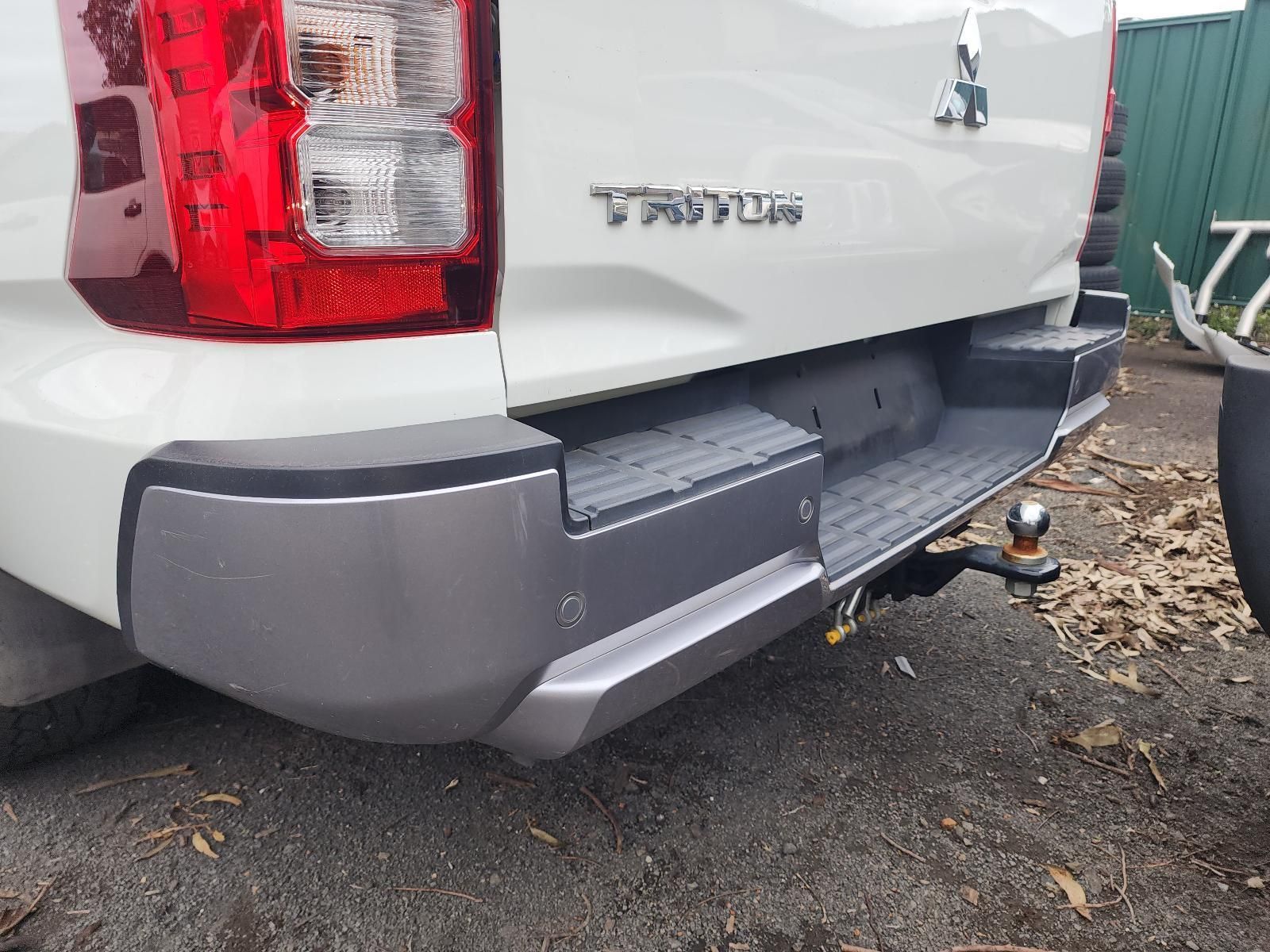 Damaged White Pickup Truck Rear Bumper — South West 4WD Wreckers In Harristown, QLD