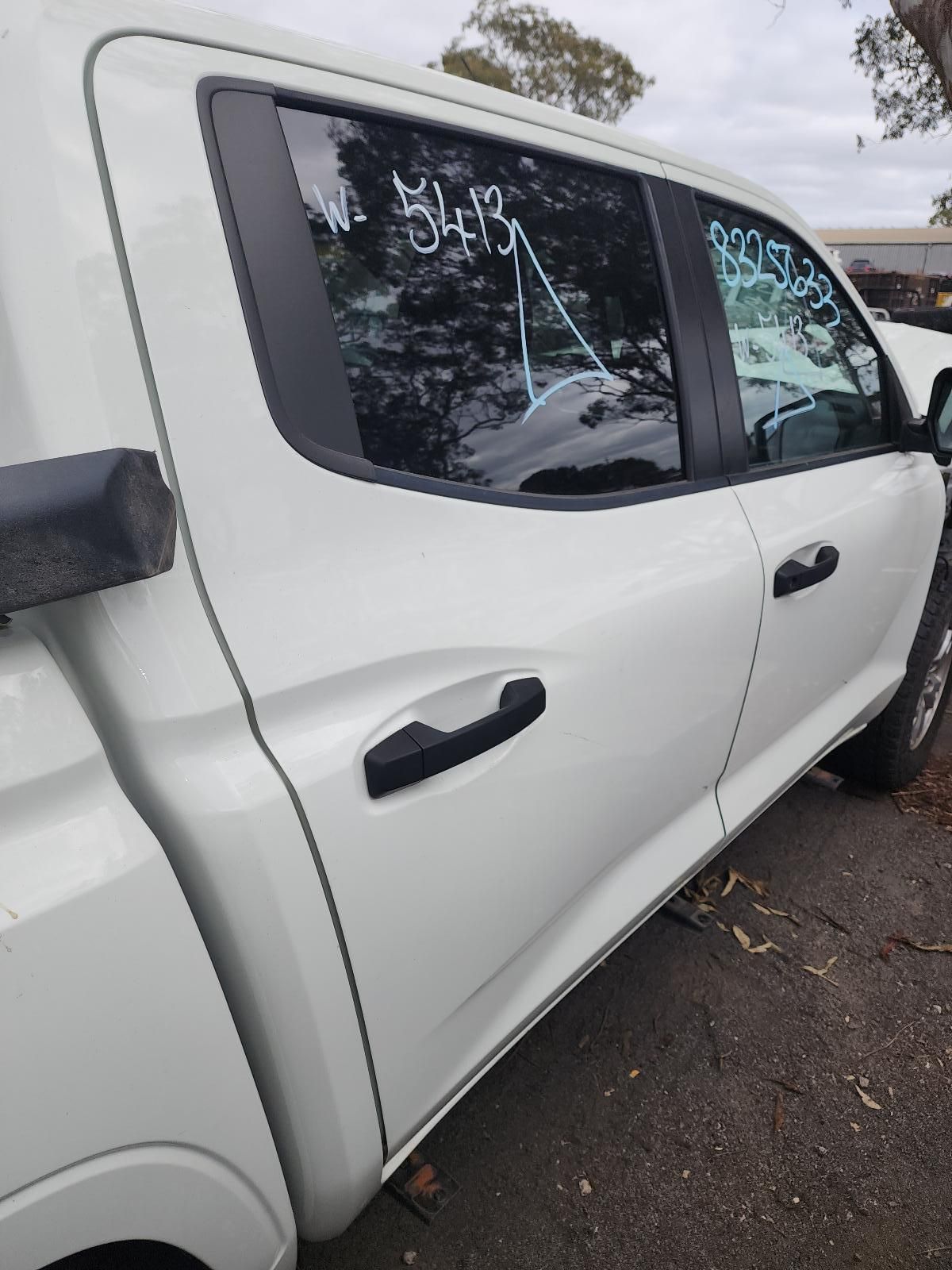 White Pickup Truck Parked on Pavement — South West 4WD Wreckers In Harristown, QLD