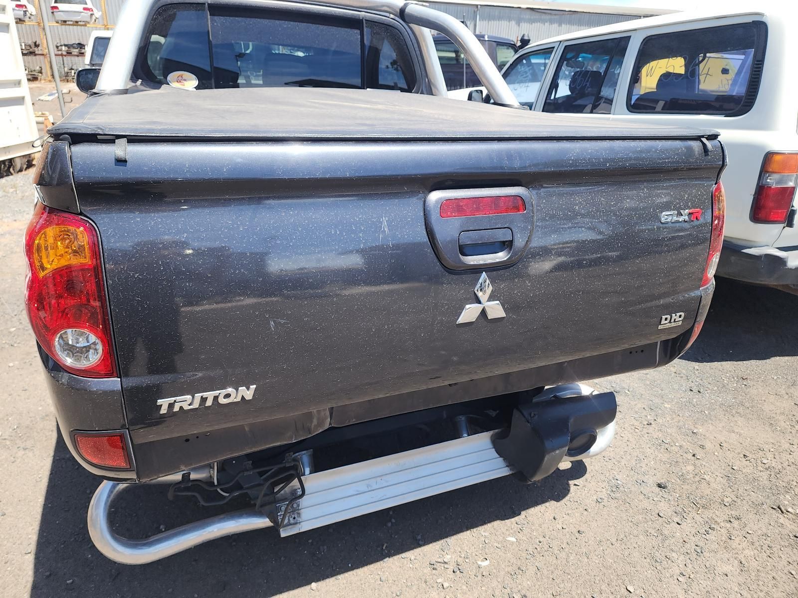 Dark Gray Mitsubishi Triton Pickup Truck Rear View — South West 4WD Wreckers In Harristown, QLD