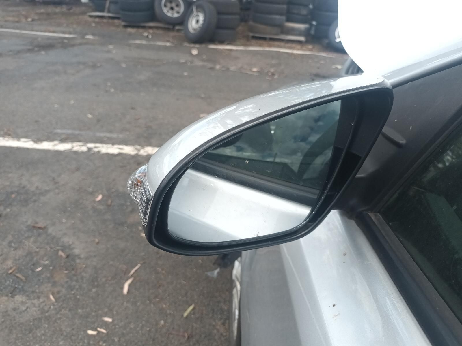 Close-Up of A White Car’s Side Mirror Parked in A Lot — South West 4WD Wreckers In Harristown, QLD