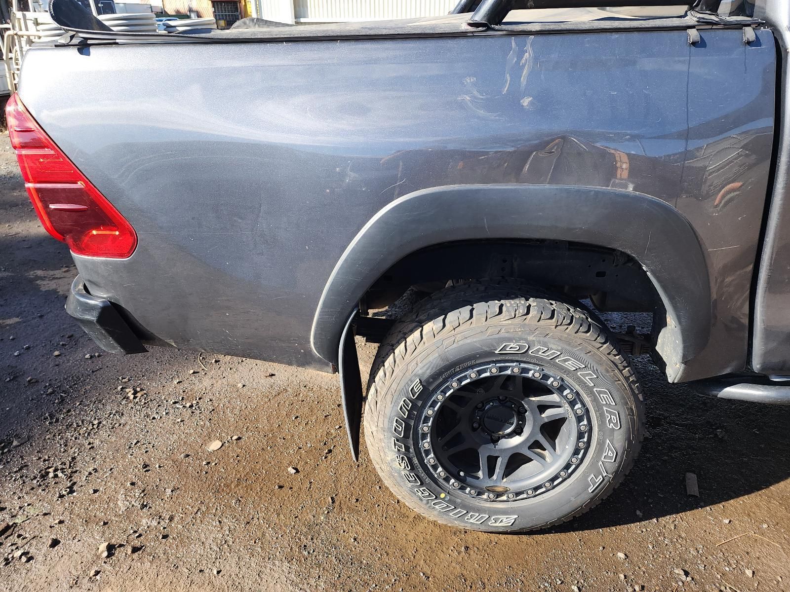 Gray Pickup Truck Bed and Rear Wheel — South West 4WD Wreckers In Harristown, QLD