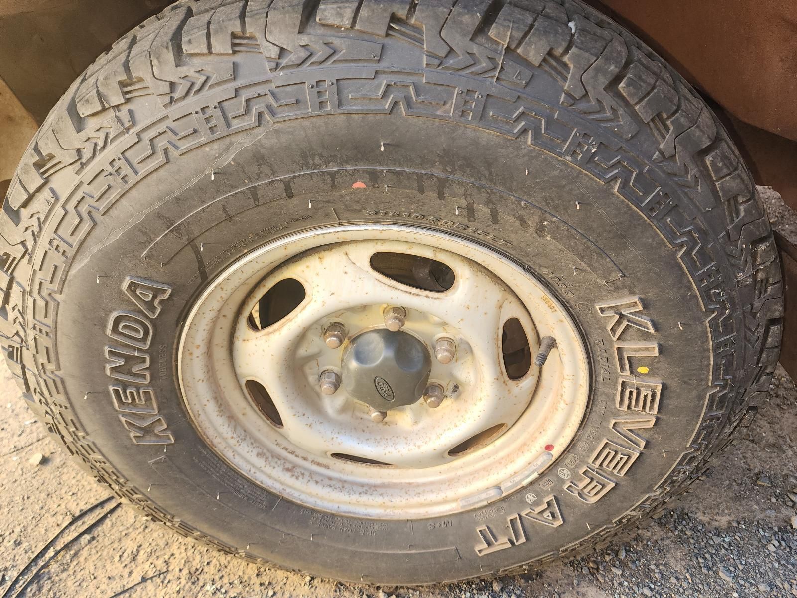 Close-up of a Dusty Car Wheel — South West 4WD Wreckers In Harristown, QLD