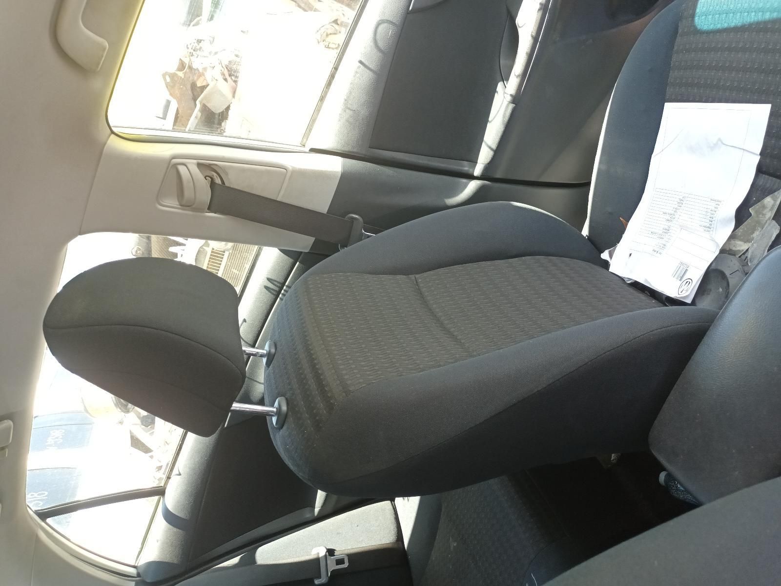 Car Seat with Black Fabric Upholstery and Headrest Inside a Sunlit Car Interior — South West 4WD Wreckers In Harristown, QLD