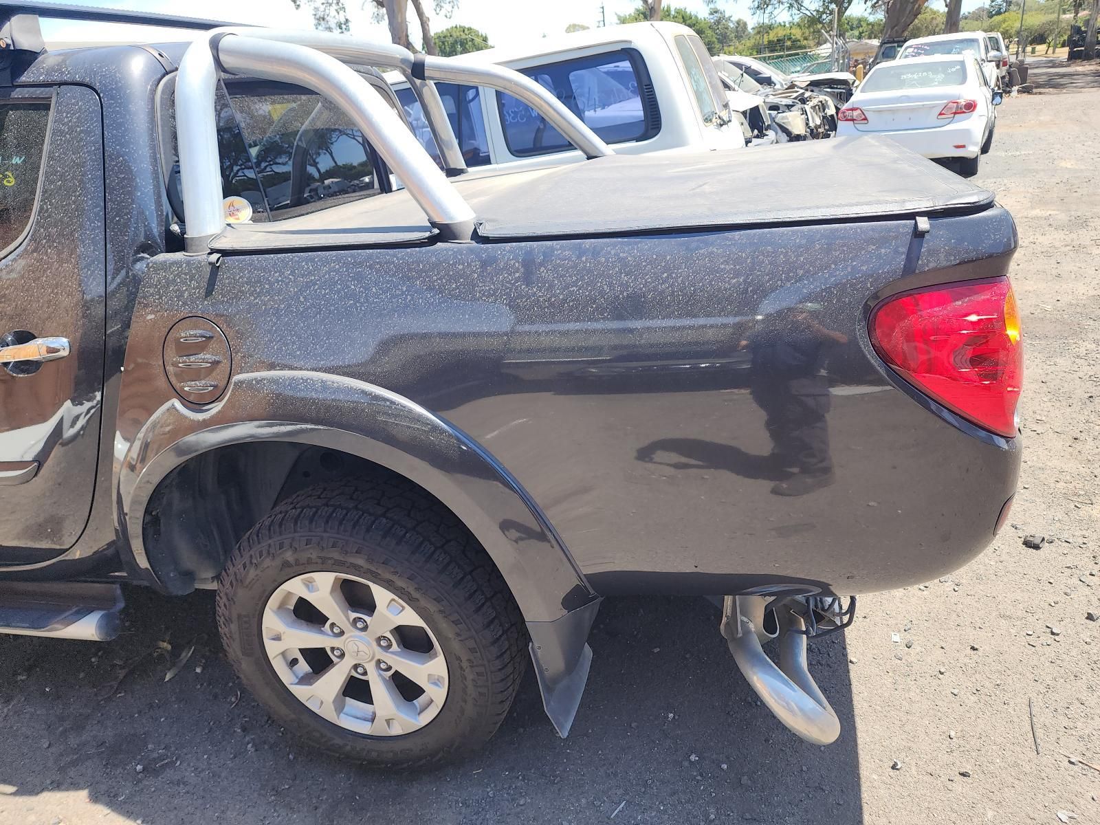 Dark Gray Pickup Truck With Rear Passenger-side Damage — South West 4WD Wreckers In Harristown, QLD