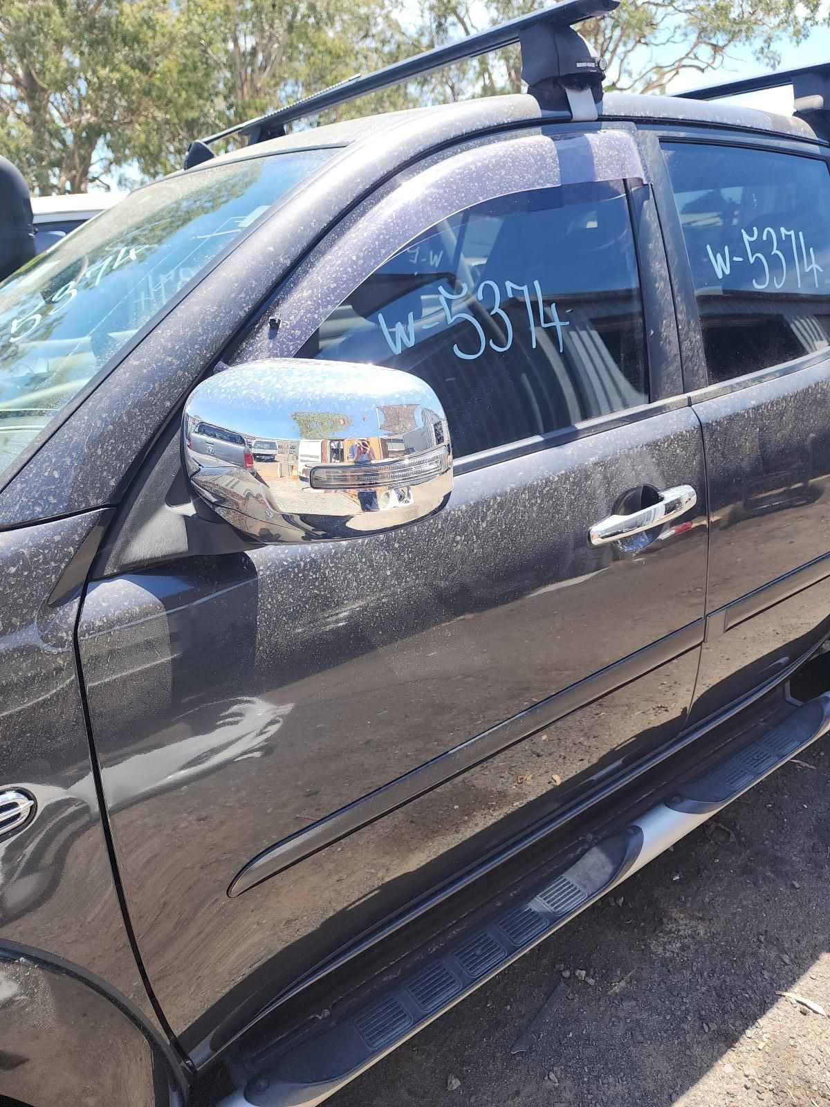 Black SUV Parked Outdoors With a Chrome Side Mirror — South West 4WD Wreckers In Harristown, QLD