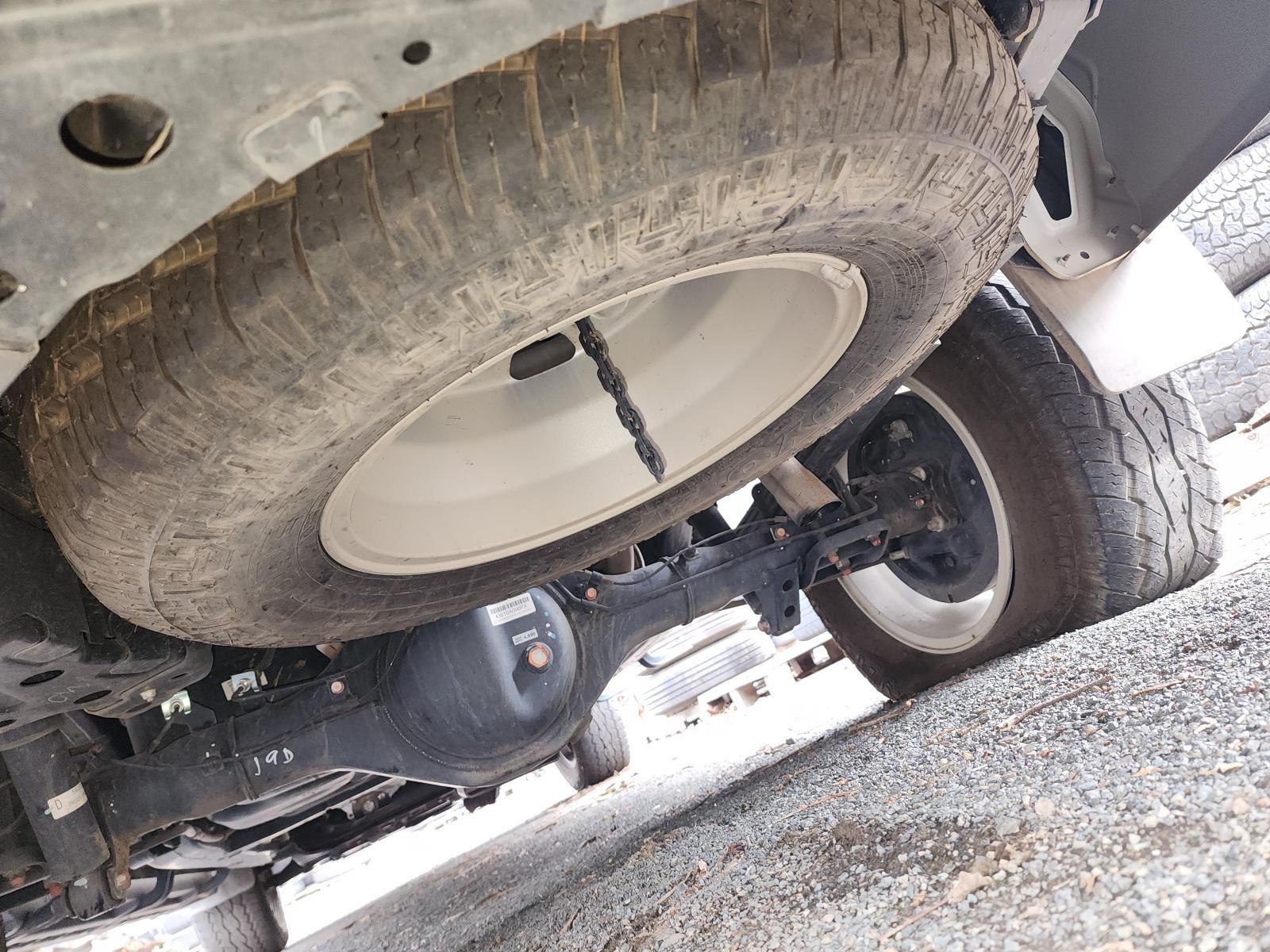 Underside of a Truck With Two Dusty Tires — South West 4WD Wreckers In Harristown, QLD