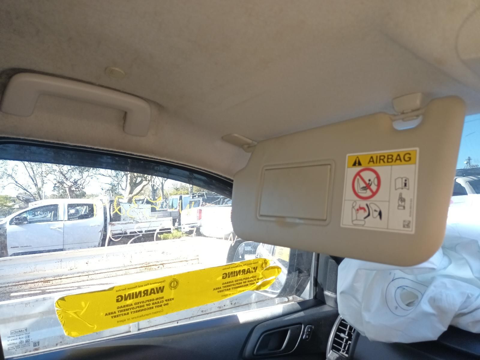 Interior of A Car with Deployed Airbags and Warning Labels — South West 4WD Wreckers In Harristown, QLD