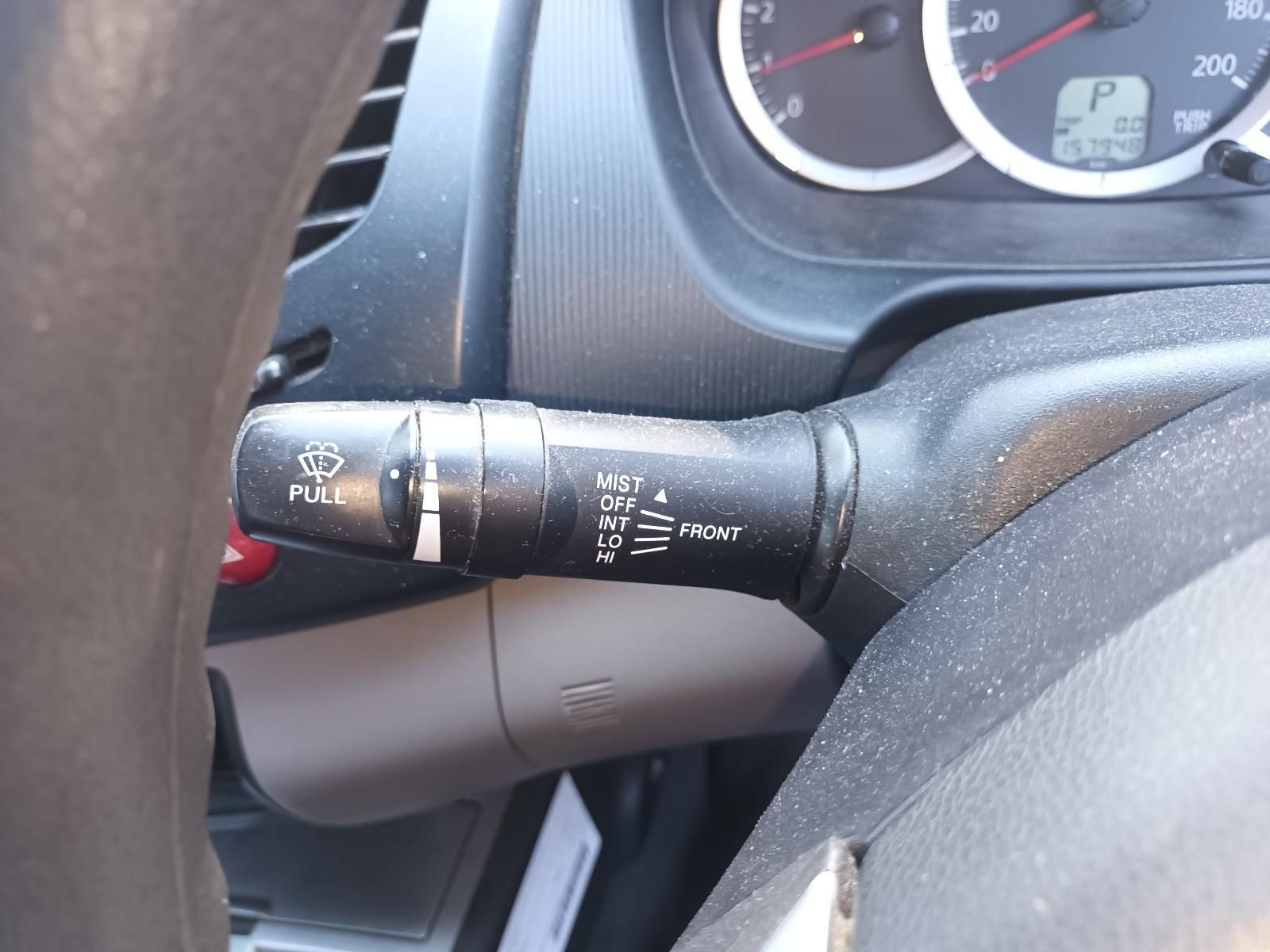 Car Steering Column with Turn-Signal Wiper Stalk and Dashboard Gauges Visible — South West 4WD Wreckers In Harristown, QLD