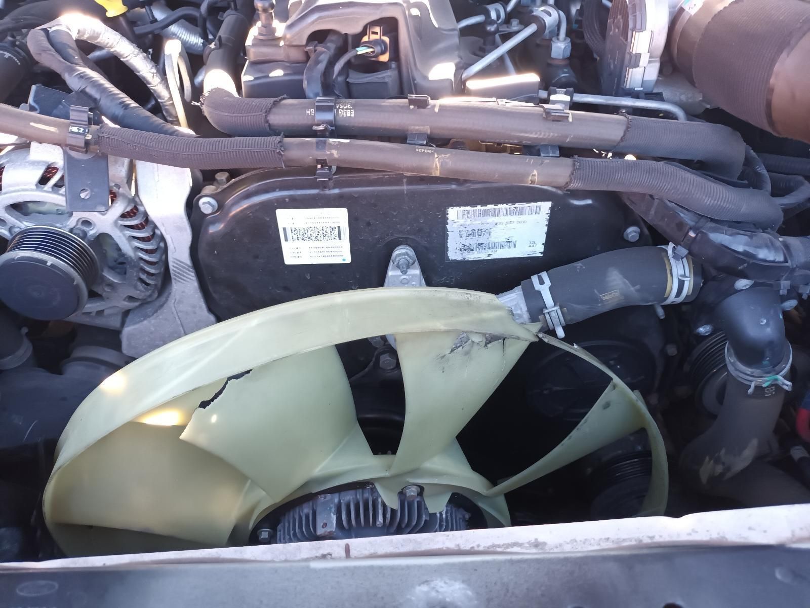 Close-Up of A Vehicle Engine Bay with Hoses, Belts, and A Large Cooling Fan — South West 4WD Wreckers In Harristown, QLD
