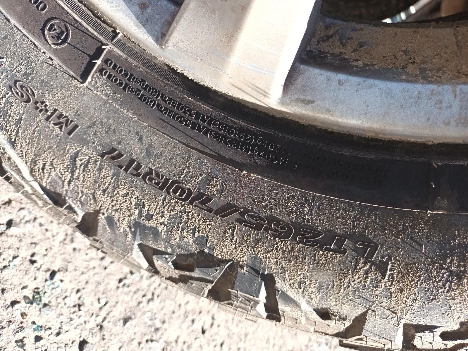 Close-Up of A Dirty Car Tyre and Rim on A Rough Road Surface — South West 4WD Wreckers In Harristown, QLD