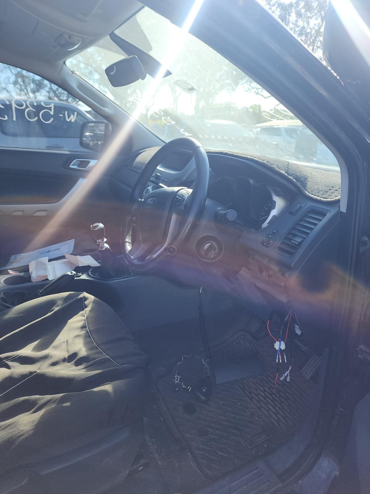 Inside a Car, a Dashboard and Steering Wheel Are Visible — South West 4WD Wreckers In Harristown, QLD