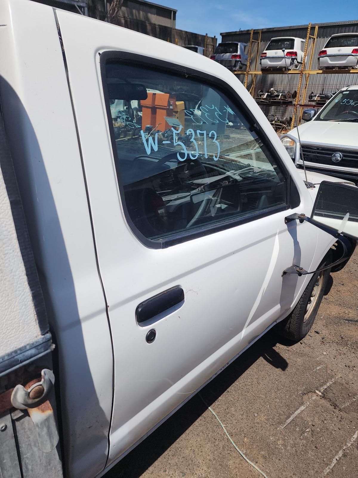 White Pickup Truck With a Damaged Front End Parked in a Lot — South West 4WD Wreckers In Harristown, QLD