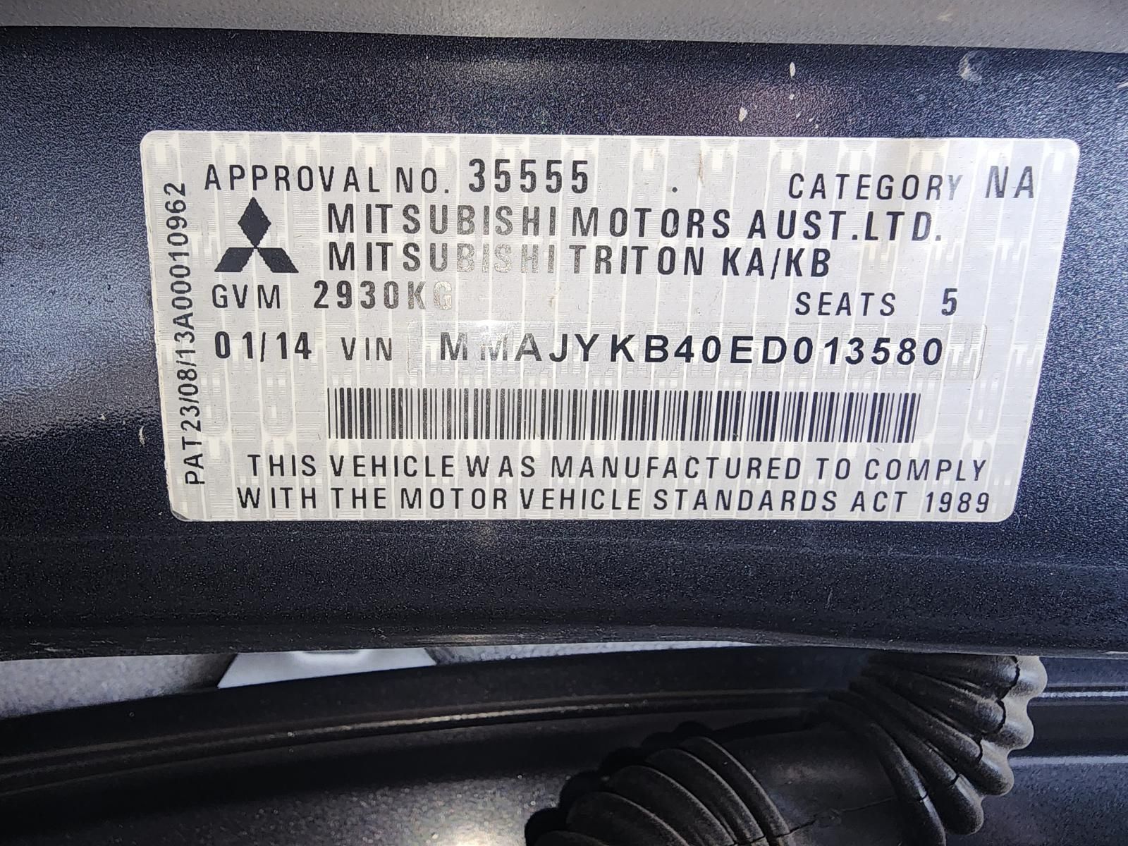 Close-up of a Mitsubishi Motors Vehicle Compliance — South West 4WD Wreckers In Harristown, QLD