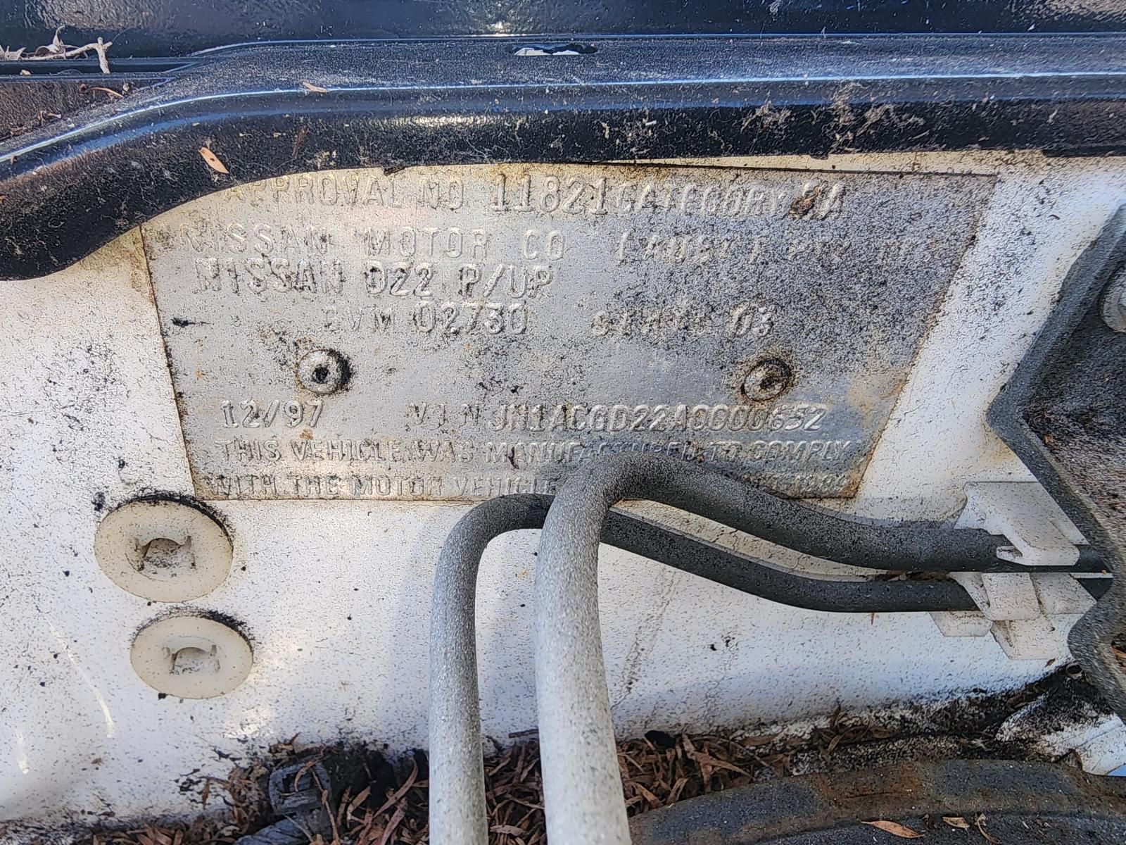 Close-up of Worn Metal Identification Plate — South West 4WD Wreckers In Harristown, QLD