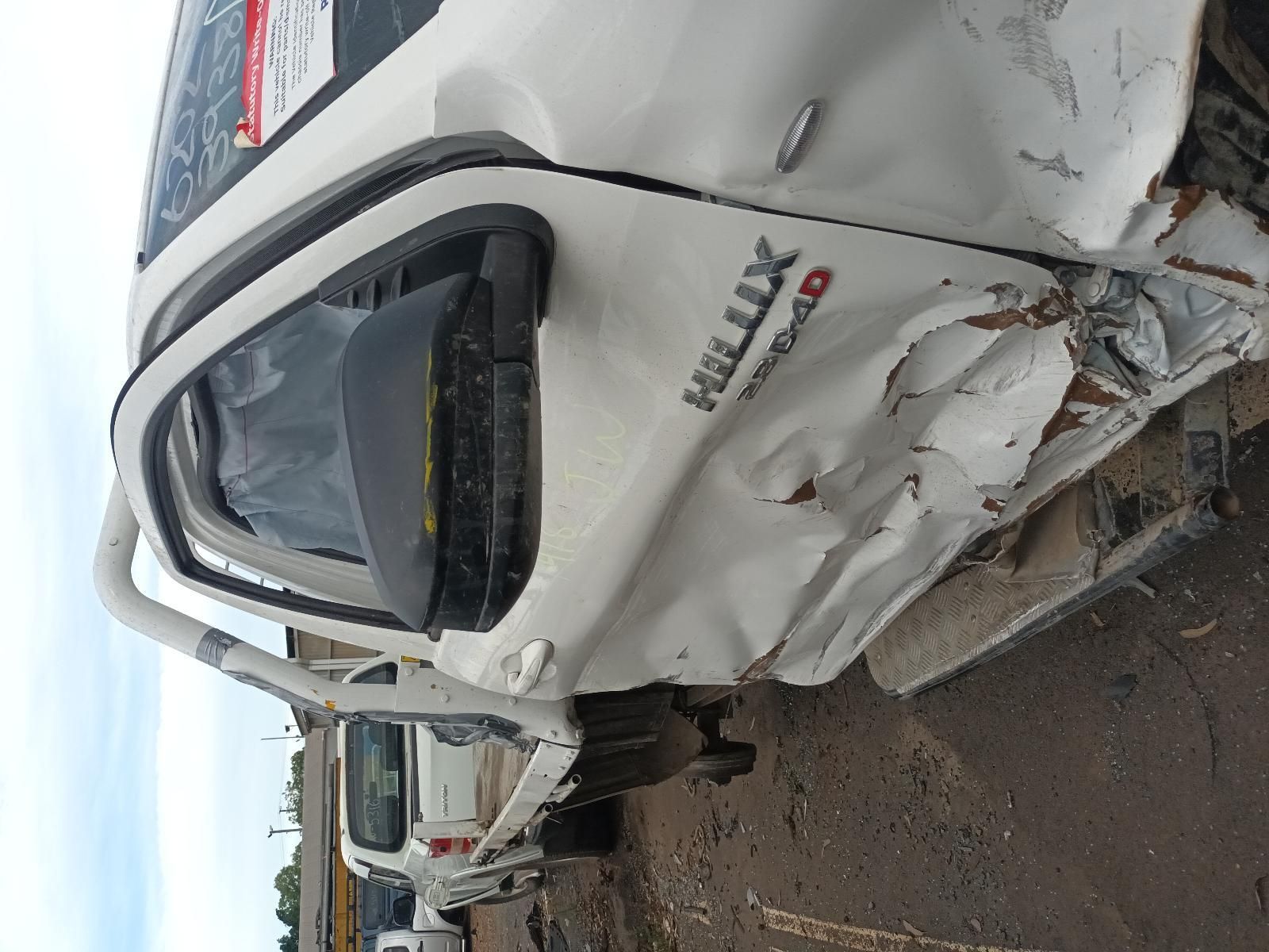 Damaged White Van with Crushed Front End on A Roadside After a Collision — South West 4WD Wreckers In Harristown, QLD