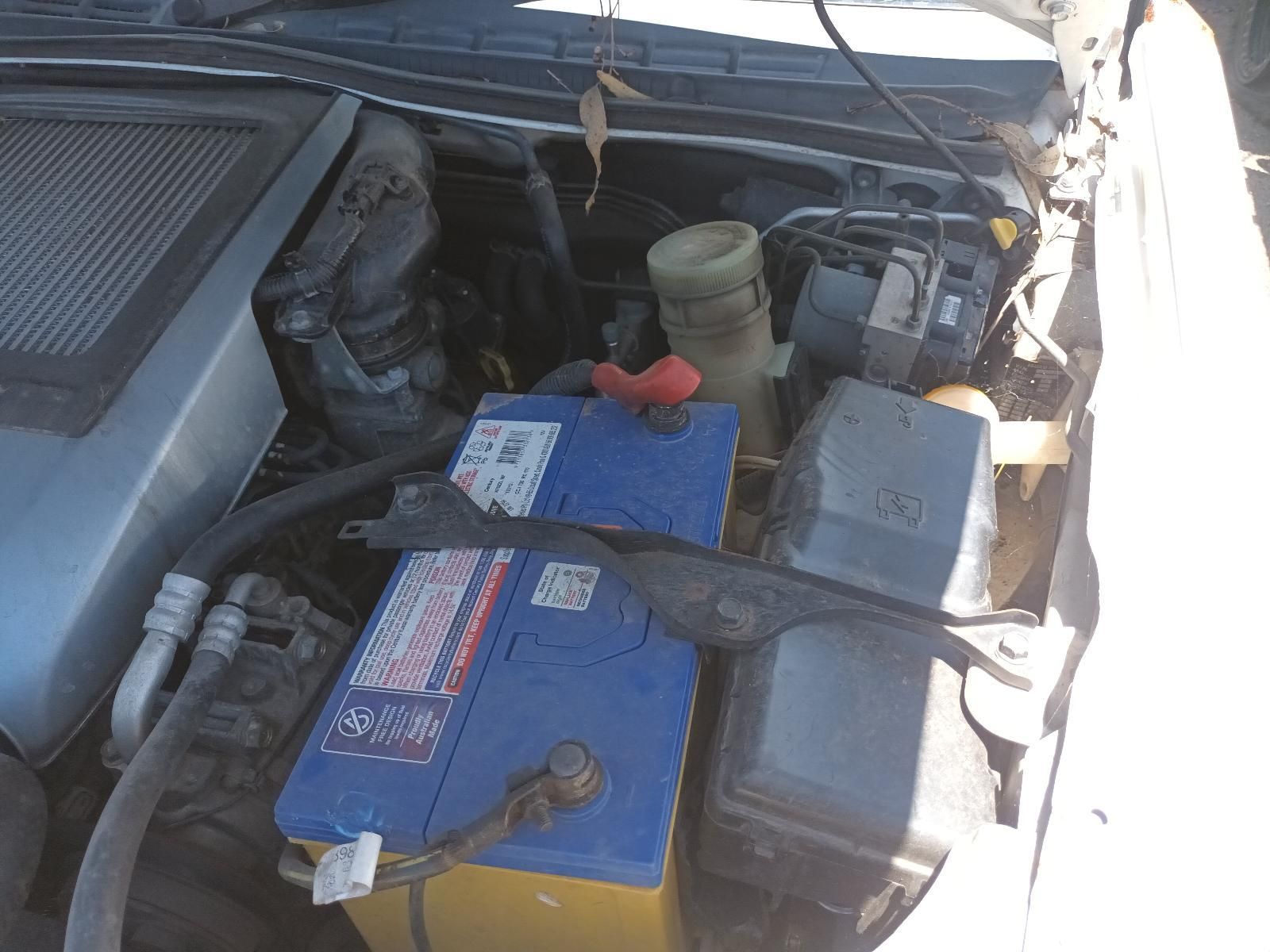 Car Engine Bay with Two Blue Batteries and Hoses Under the Hood — South West 4WD Wreckers In Harristown, QLD