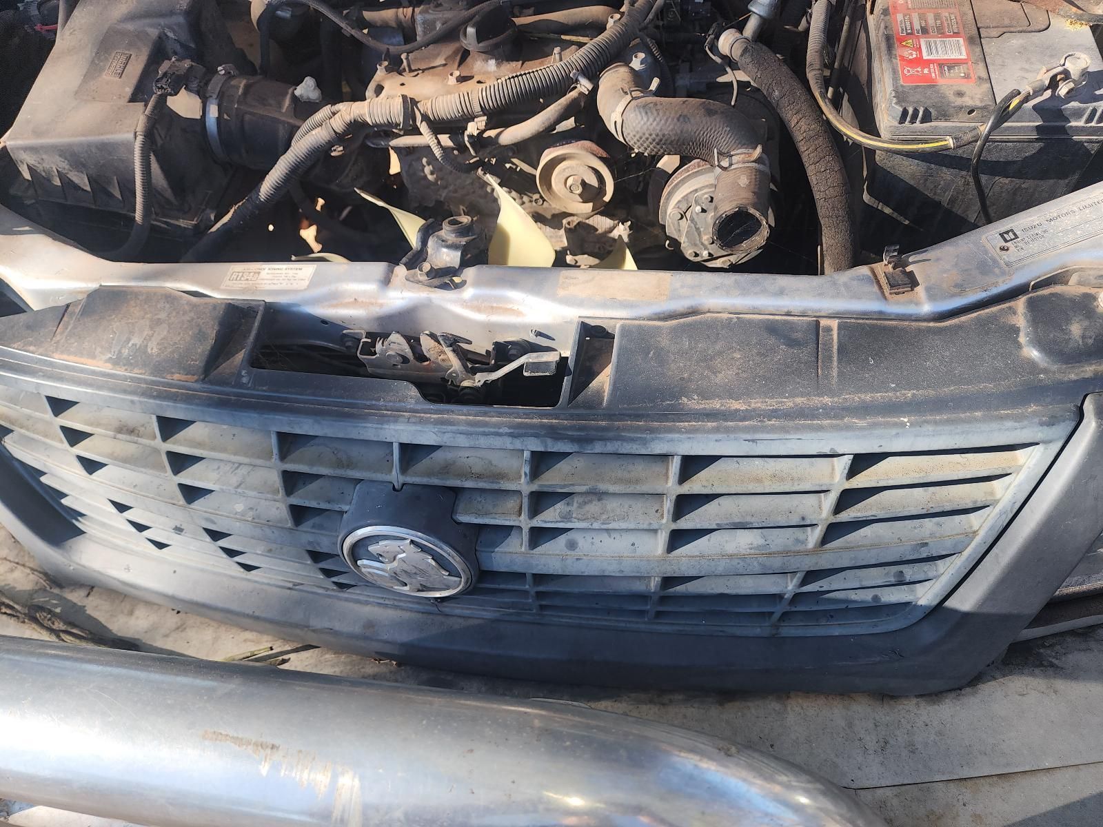 Damaged Car Front with Broken Grille and Exposed Engine Components — South West 4WD Wreckers In Harristown, QLD