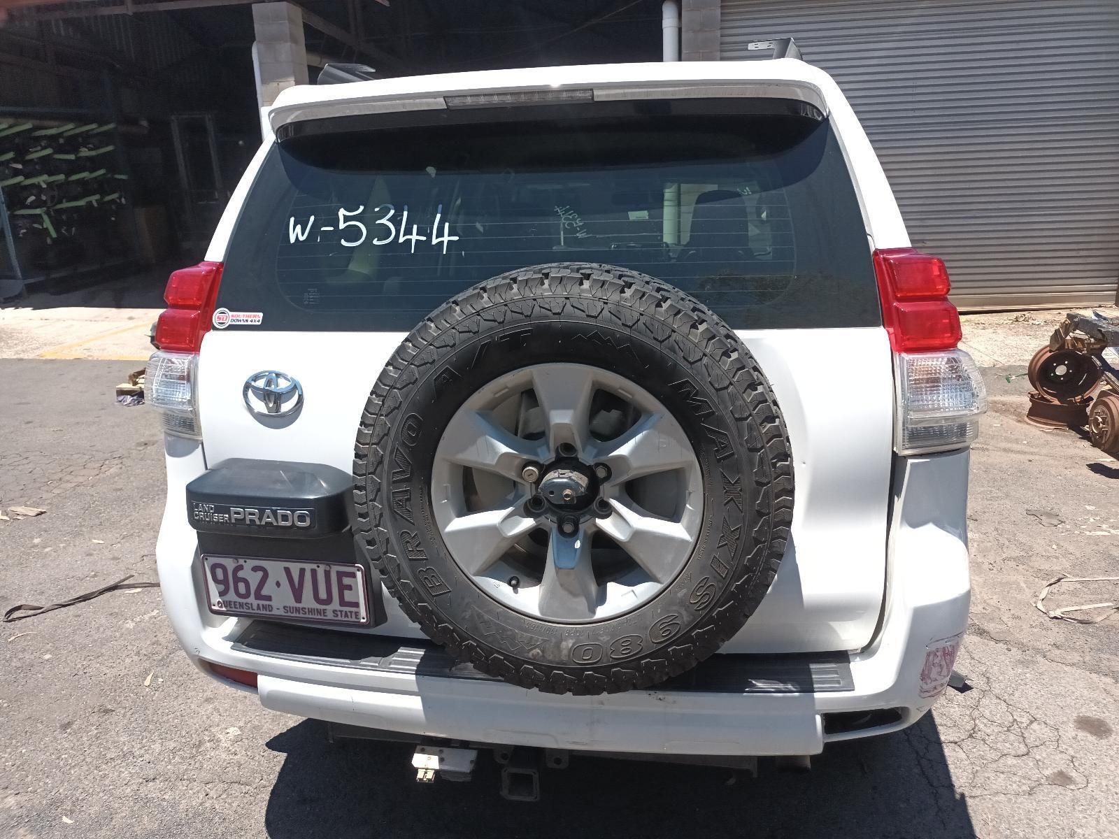 White Suv Parked Outdoors with A Spare Tyre on The Back — South West 4WD Wreckers In Harristown, QLD