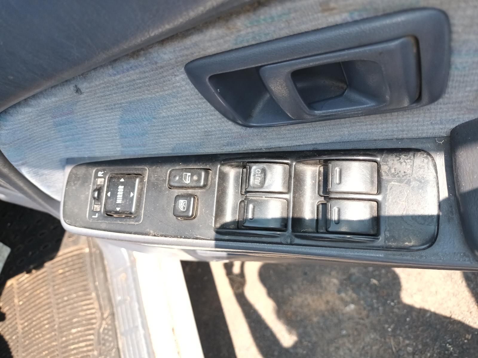 Car Door Interior with Power Window and Lock Controls on A Black Armrest — South West 4WD Wreckers In Harristown, QLD