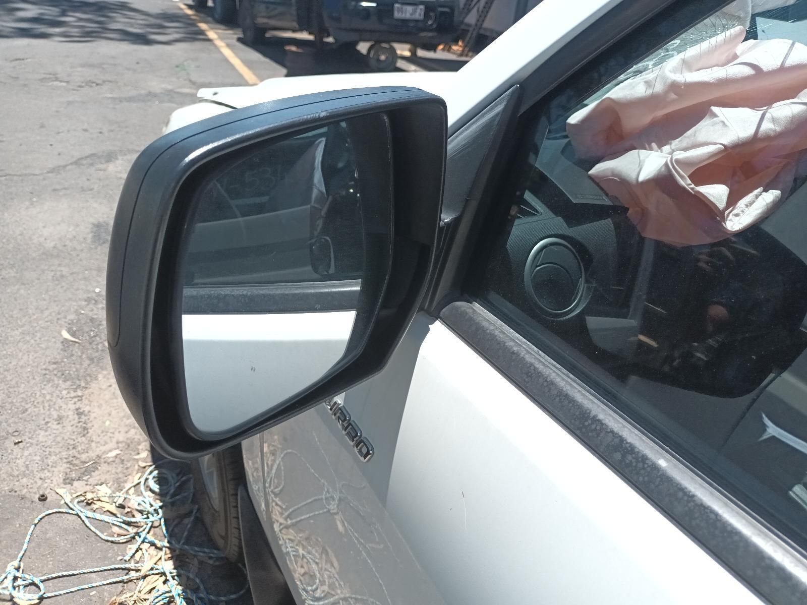 Broken Side Mirror on A White Car with Exposed Wires Near the Door — South West 4WD Wreckers In Harristown, QLD