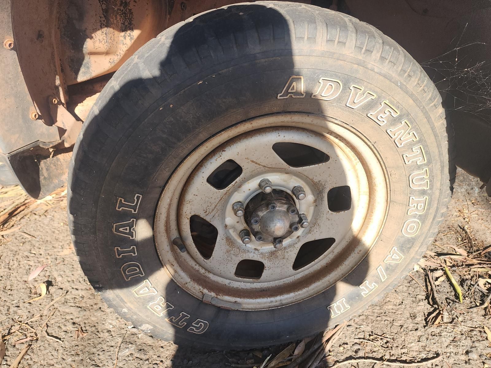 Close-Up of A Dusty Off-Road Tire and Steel Wheel — South West 4WD Wreckers In Harristown, QLD