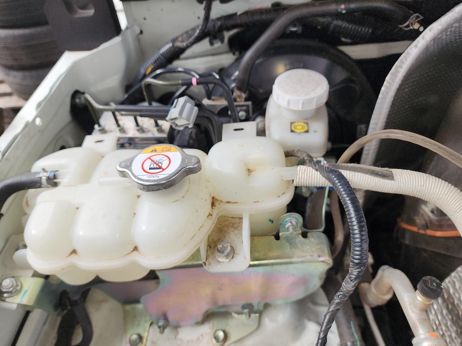 Car Engine Compartment With White Coolant Reservoir — South West 4WD Wreckers In Harristown, QLD