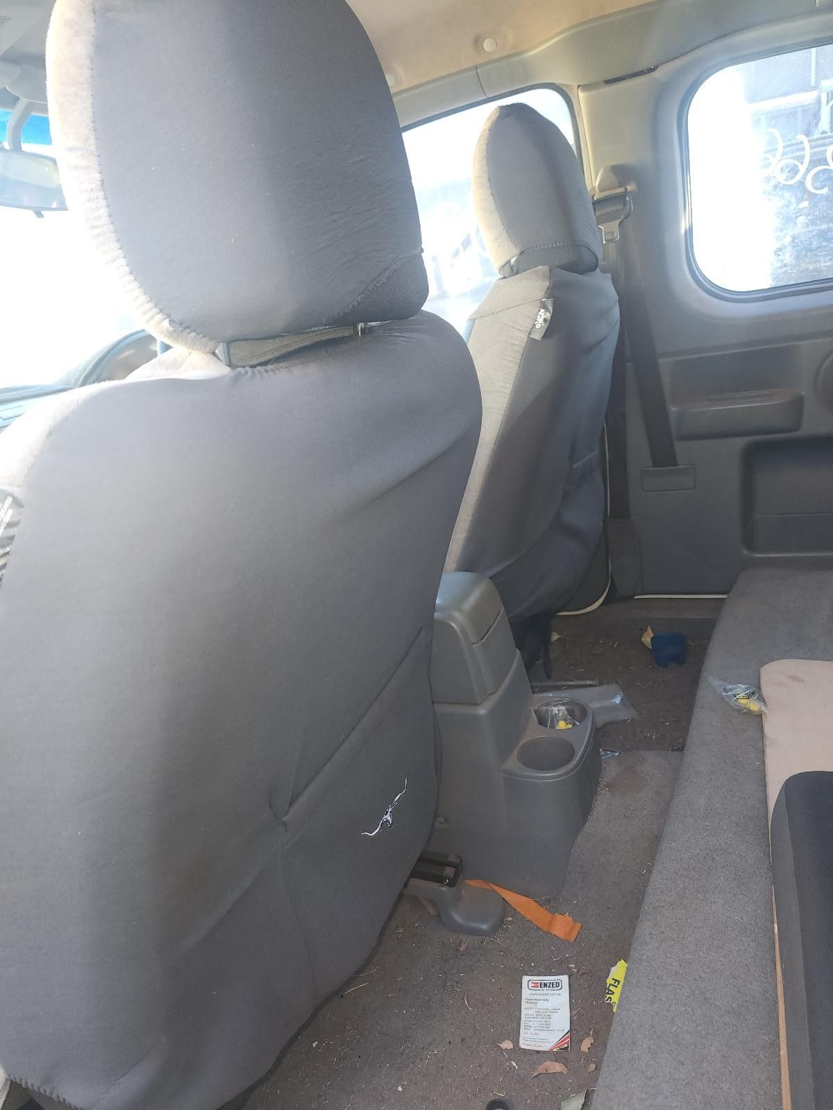 Interior of a Vehicle With Gray Fabric Seats and a Rear Bench — South West 4WD Wreckers In Harristown, QLD