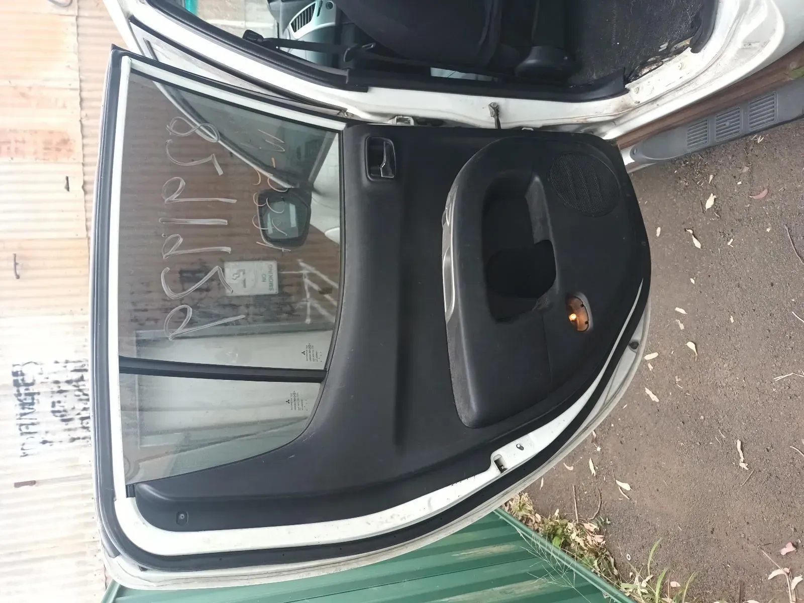 Open Car Door, Black Interior Panel, White Exterior, Reflective Window, Outdoors — South West 4WD Wreckers In Harristown, QLD