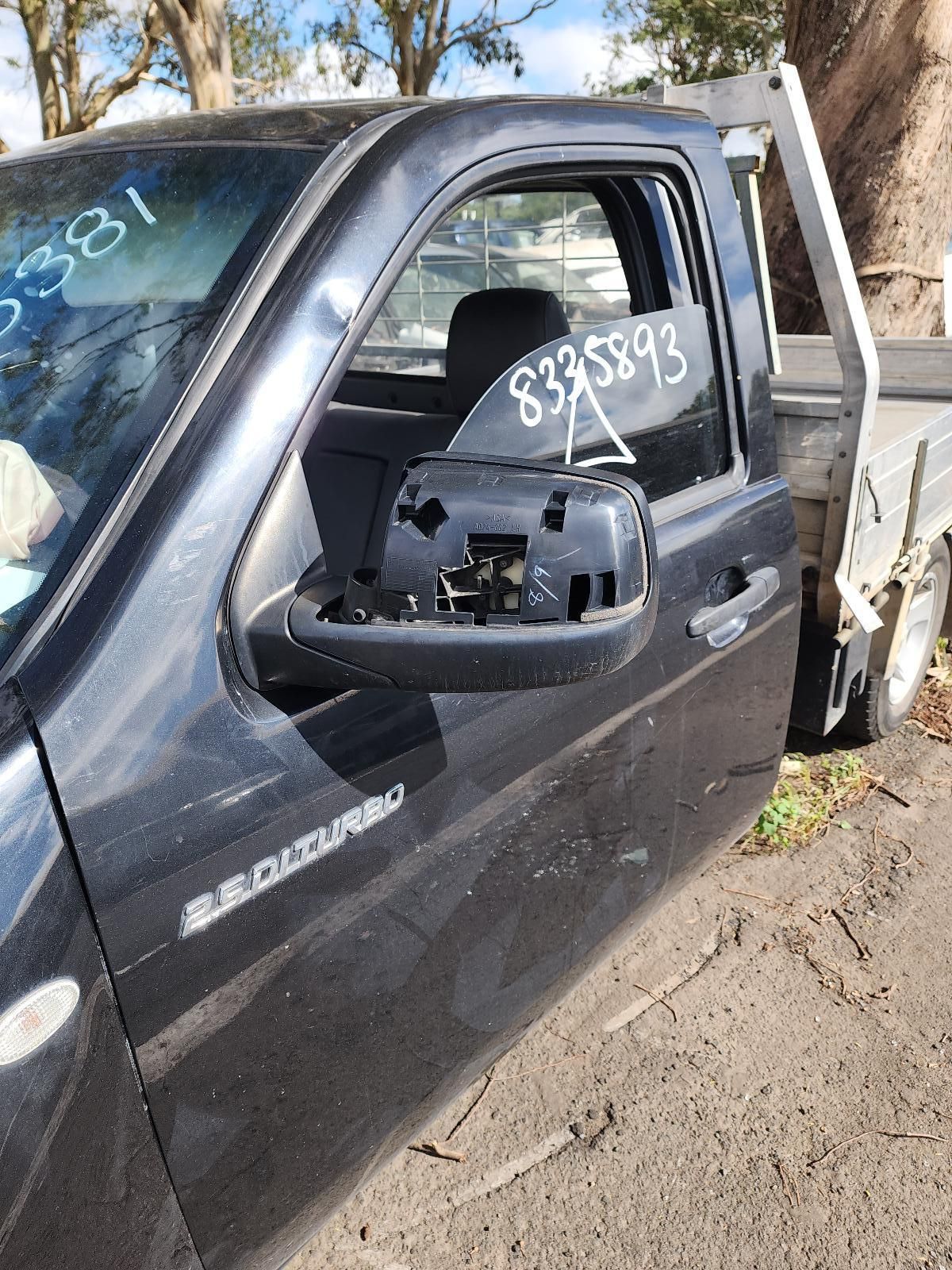 Black Pickup Truck With Broken Side Mirror and Damaged Window — South West 4WD Wreckers In Harristown, QLD