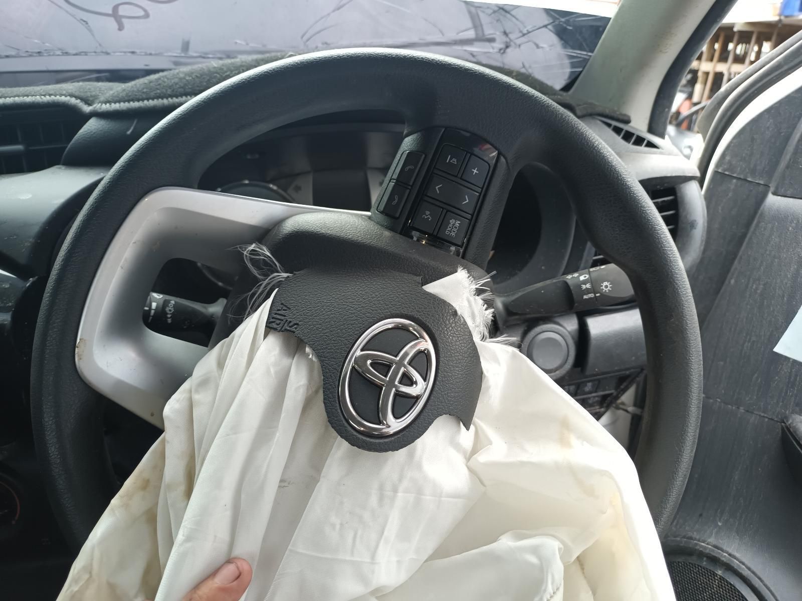 Car Interior with Deployed Driver Airbag and Toyota Steering Wheel After a Crash — South West 4WD Wreckers In Harristown, QLD