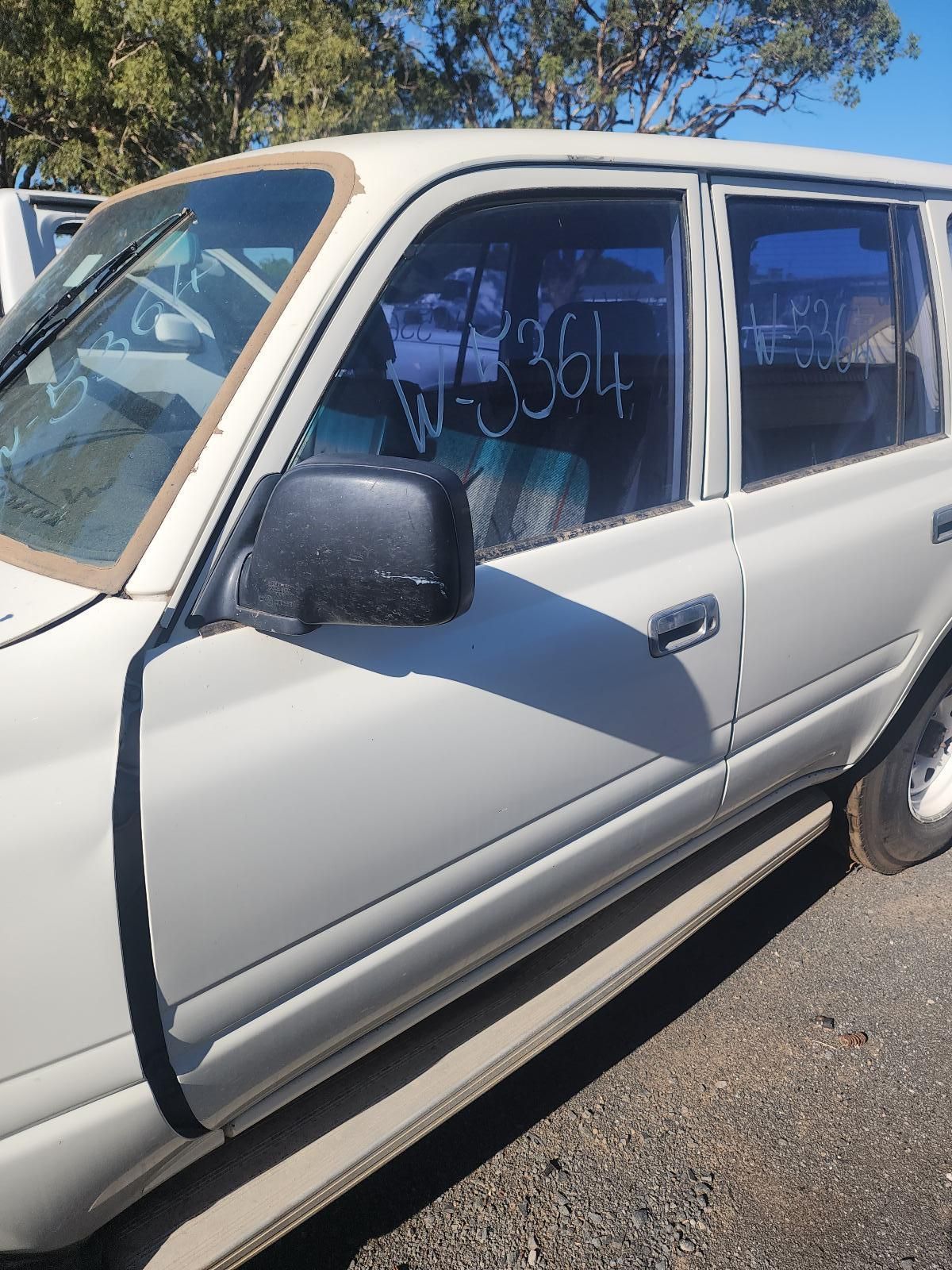 White Car Door with Black Side Mirror and Tinted Window — South West 4WD Wreckers In Harristown, QLD