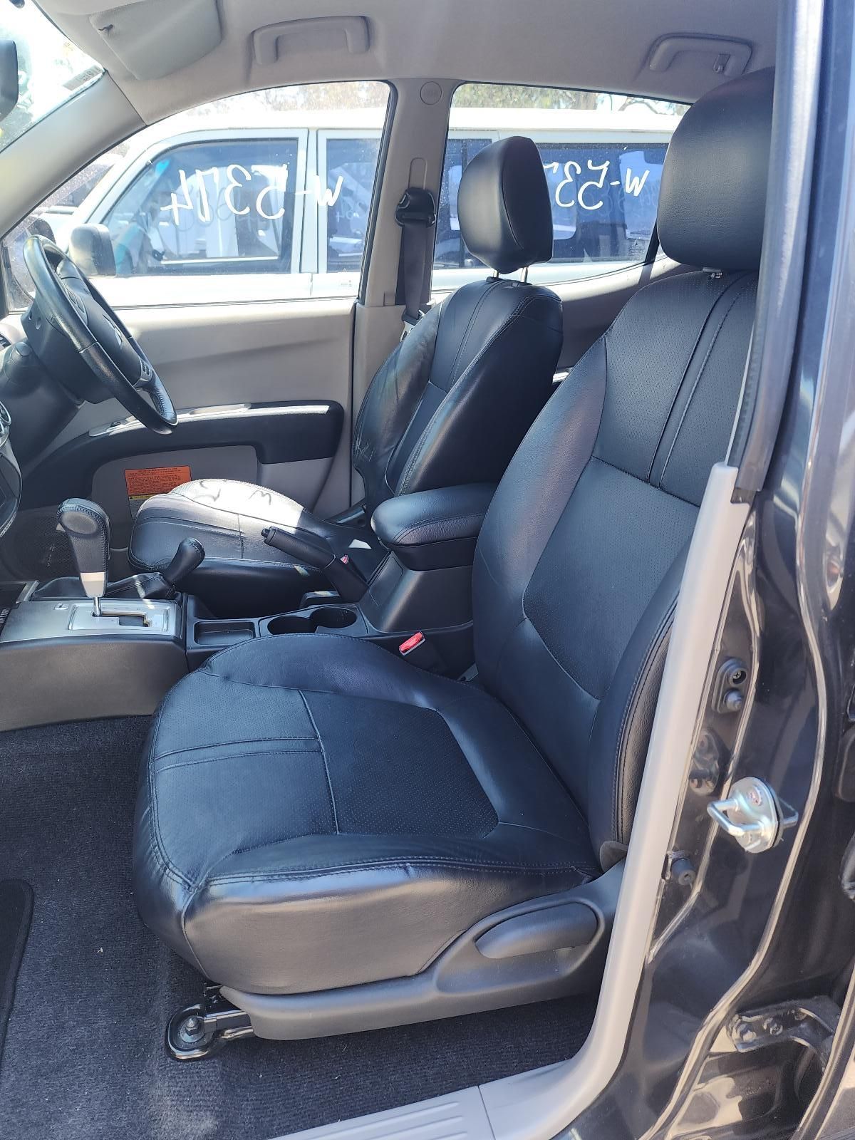 Car Interior With Black Cloth Front Seats — South West 4WD Wreckers In Harristown, QLD