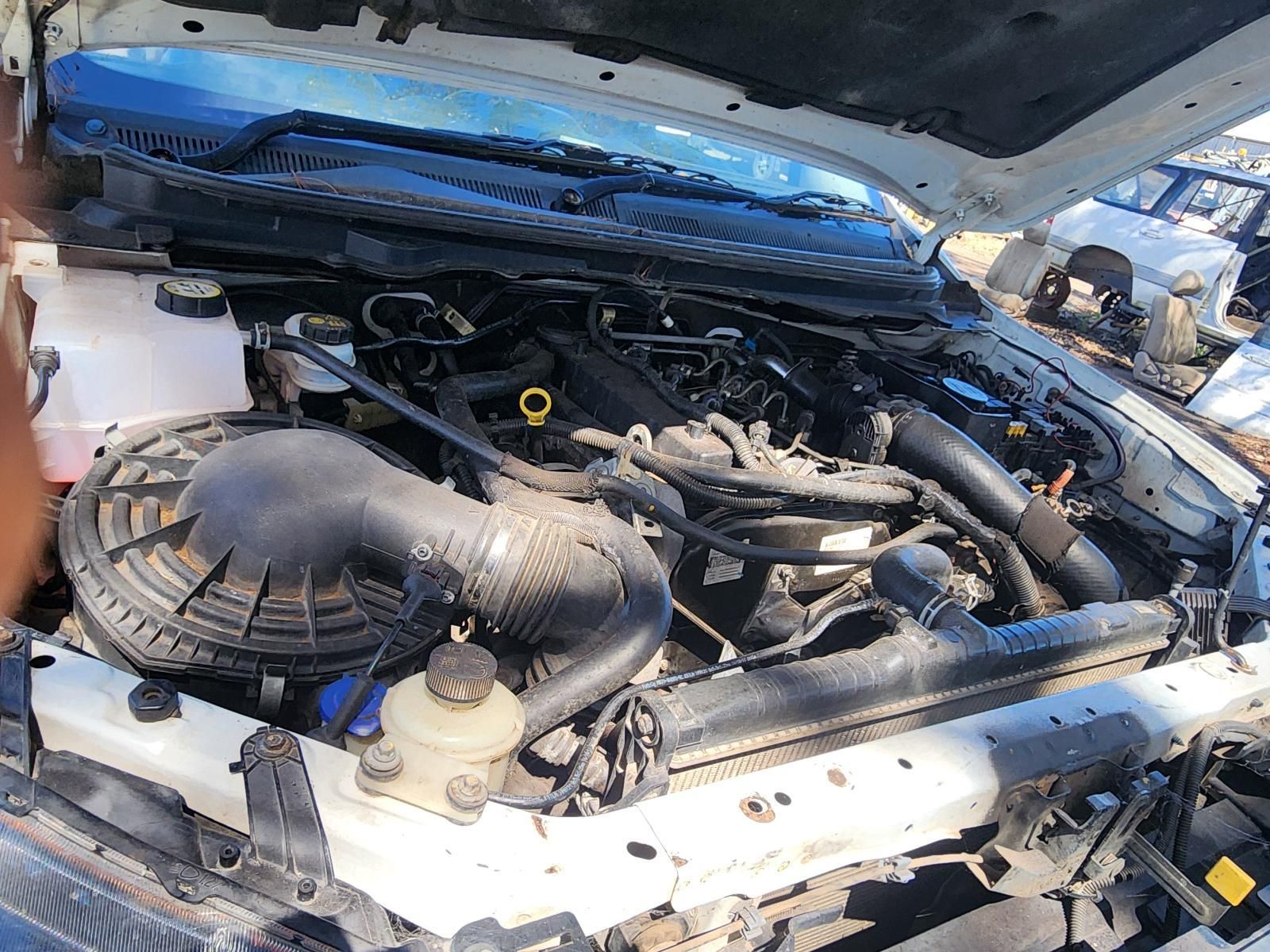 Open Car Hood Showing a Dusty Engine Bay — South West 4WD Wreckers In Harristown, QLD