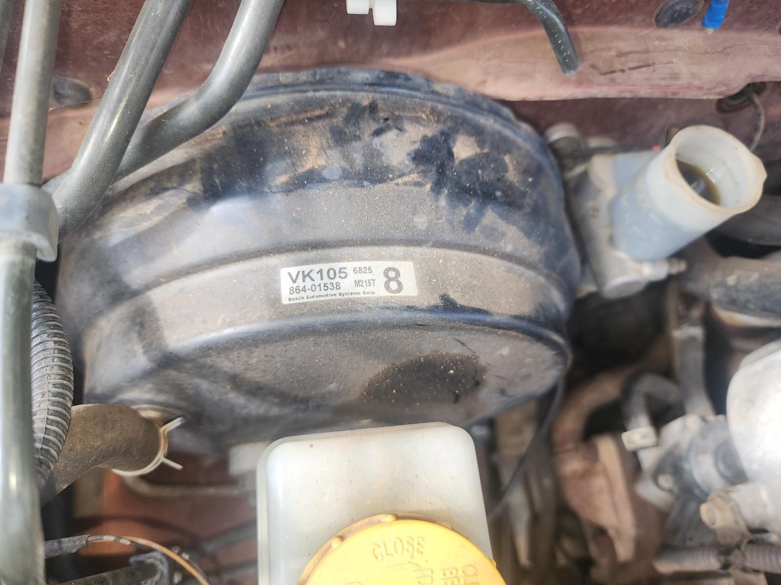Close-up of a Dusty Black Automotive Vacuum/Brake Booster — South West 4WD Wreckers In Harristown, QLD