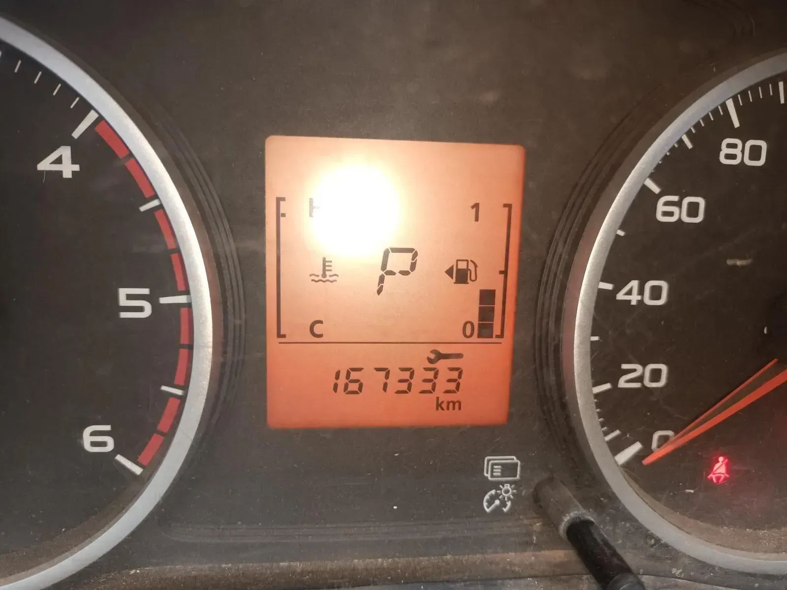 Dashboard With Odometer Reading 167333 Km, and a Warning Light — South West 4WD Wreckers In Harristown, QLD