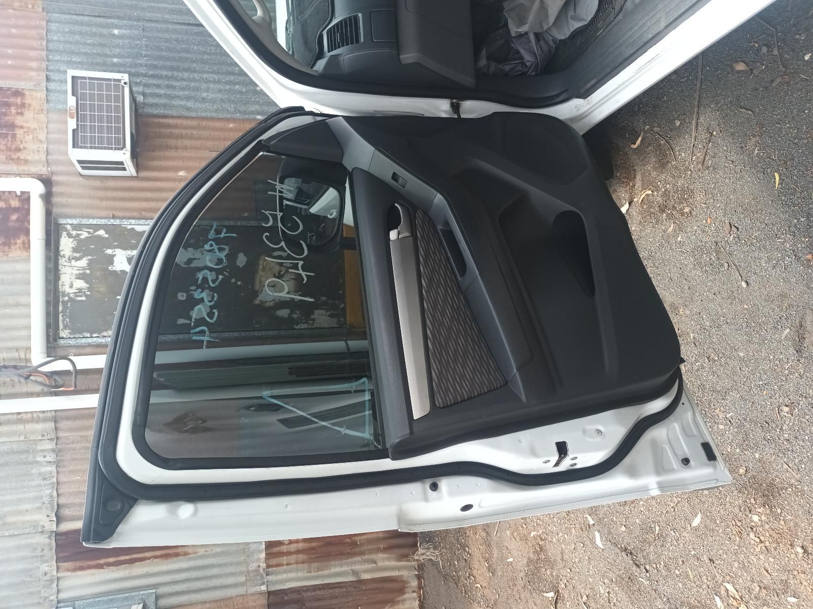 Open White Car Door Revealing Black Interior Seats — South West 4WD Wreckers In Harristown, QLD