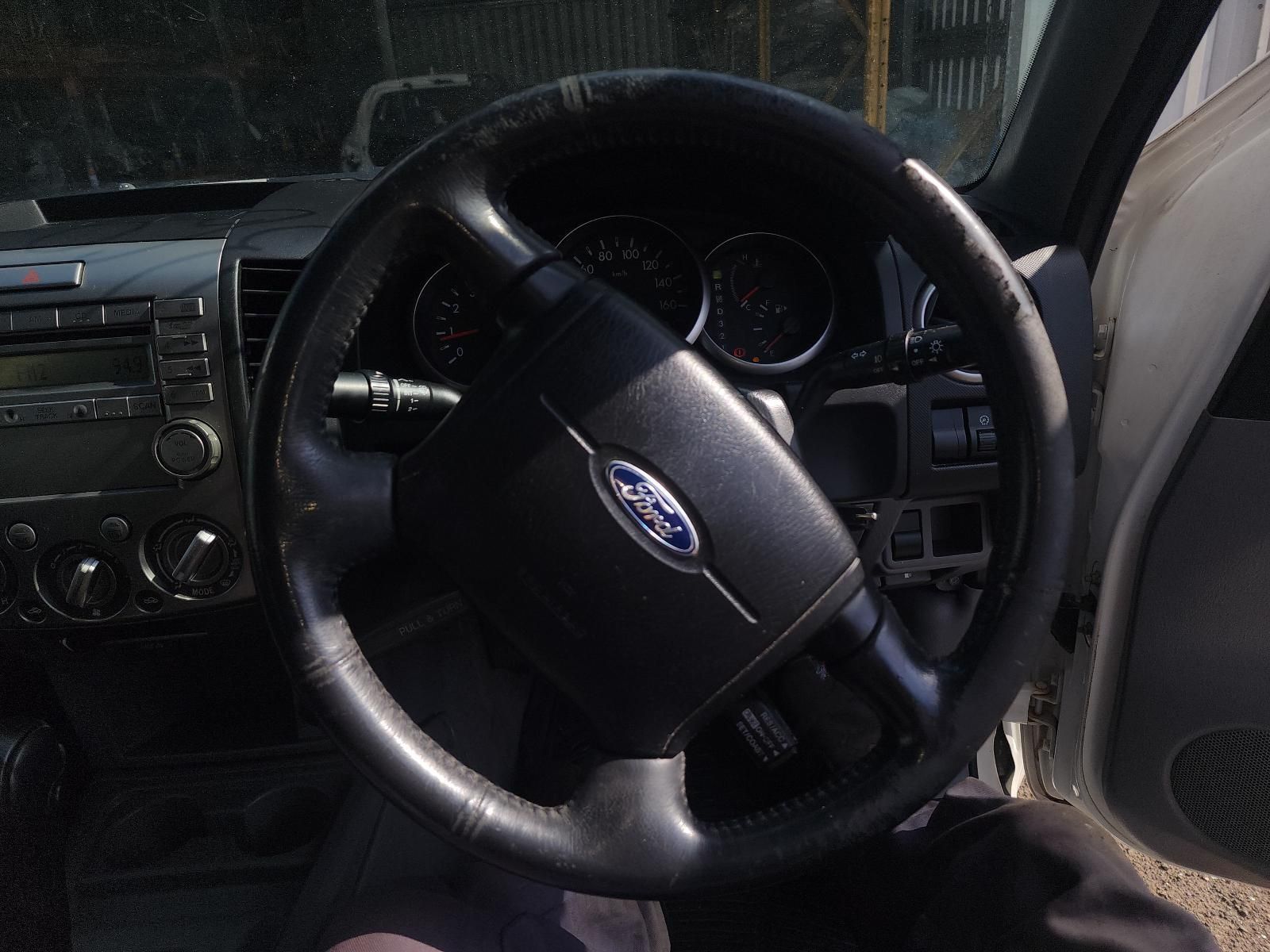 Car Dashboard Interior With Black Steering Wheel — South West 4WD Wreckers In Harristown, QLD