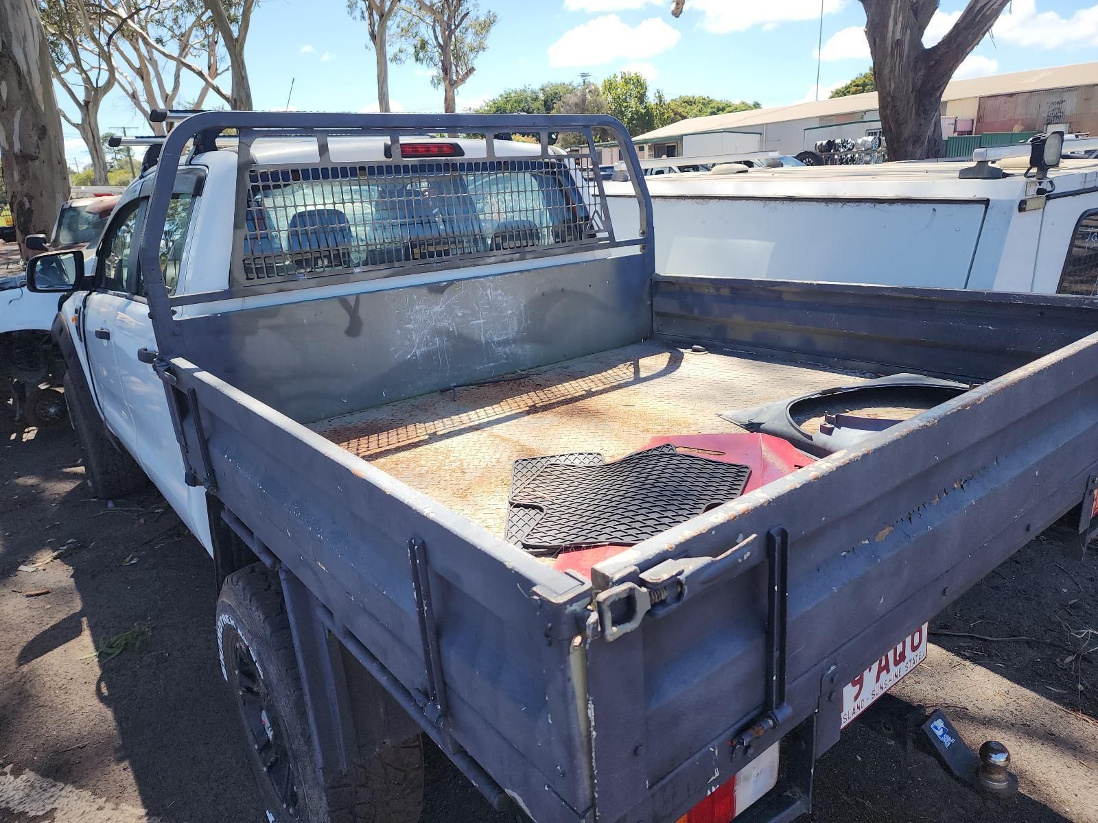 White Pickup Truck With an Open Flatbed Parked — South West 4WD Wreckers In Harristown, QLD