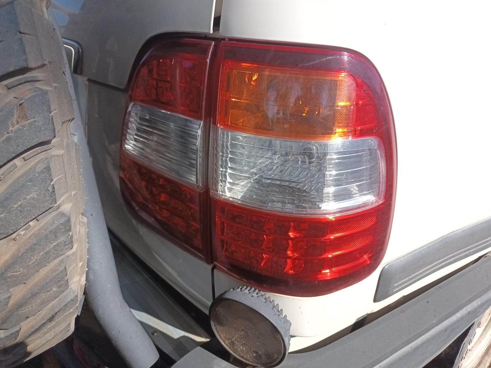 Close-Up of A Silver Car’s Rear Taillight and Bumper — South West 4WD Wreckers In Harristown, QLD