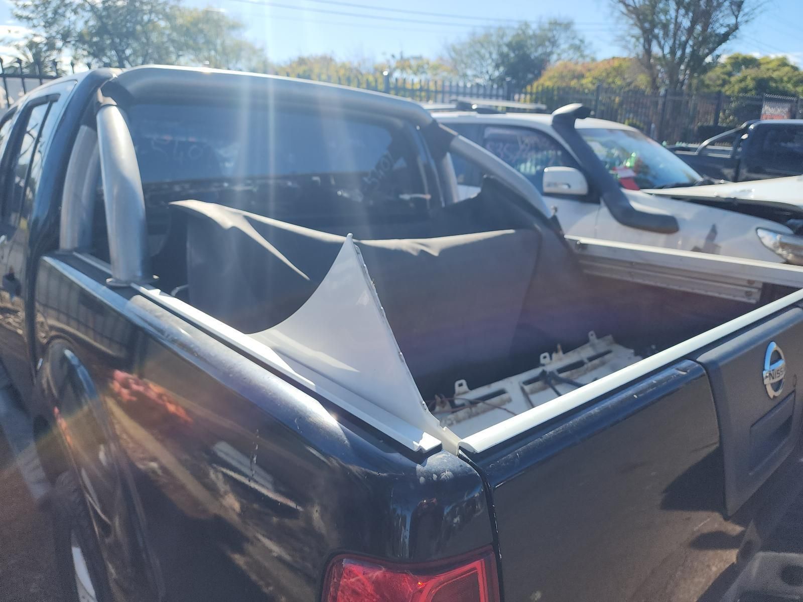 Black Pickup Truck With a Collapsed Rear Window — South West 4WD Wreckers In Harristown, QLD