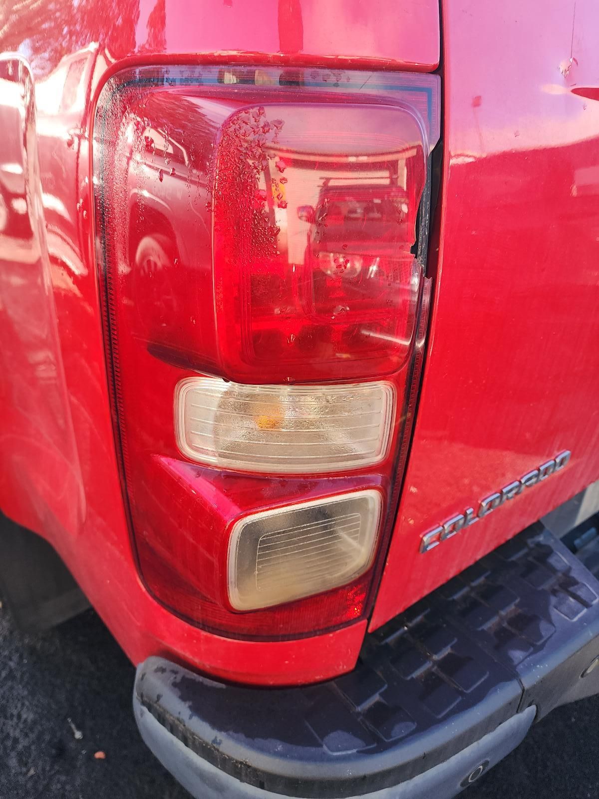 Rear Corner of a Red Pickup Truck With Taillight — South West 4WD Wreckers In Harristown, QLD