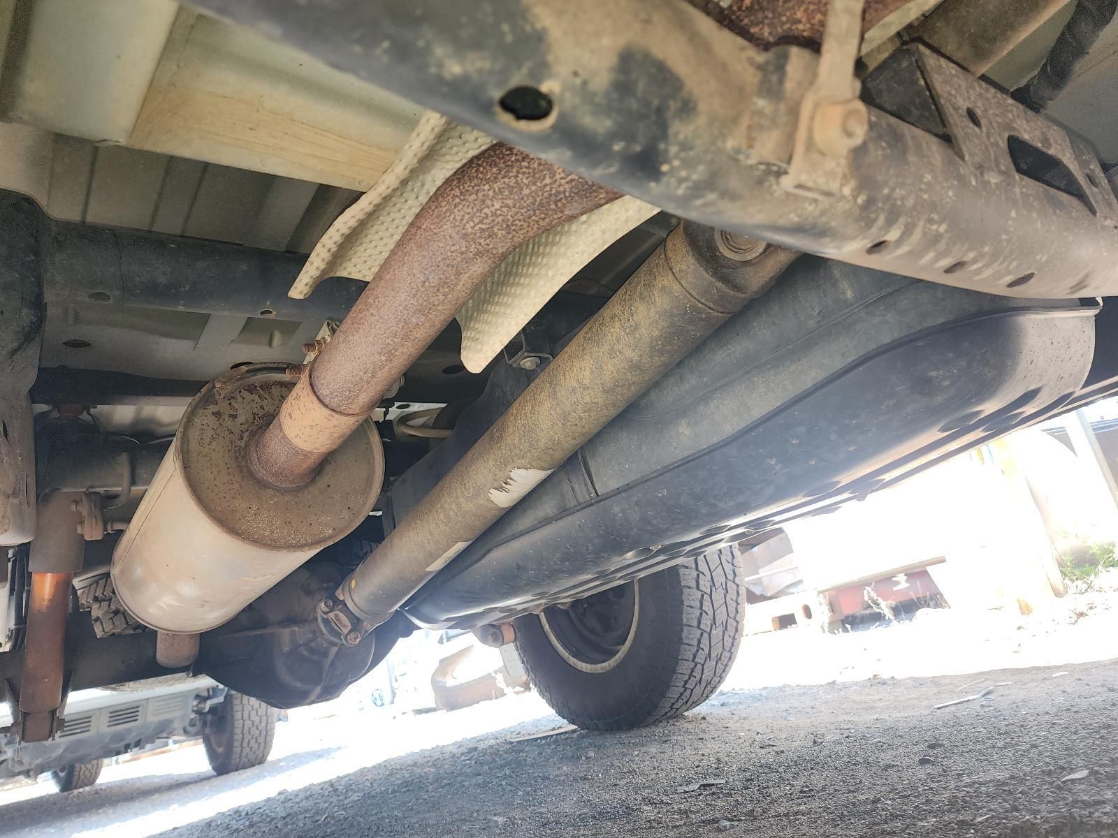 Undercarriage View of a Vehicle Showing Rusty Exhaust Pipe — South West 4WD Wreckers In Harristown, QLD