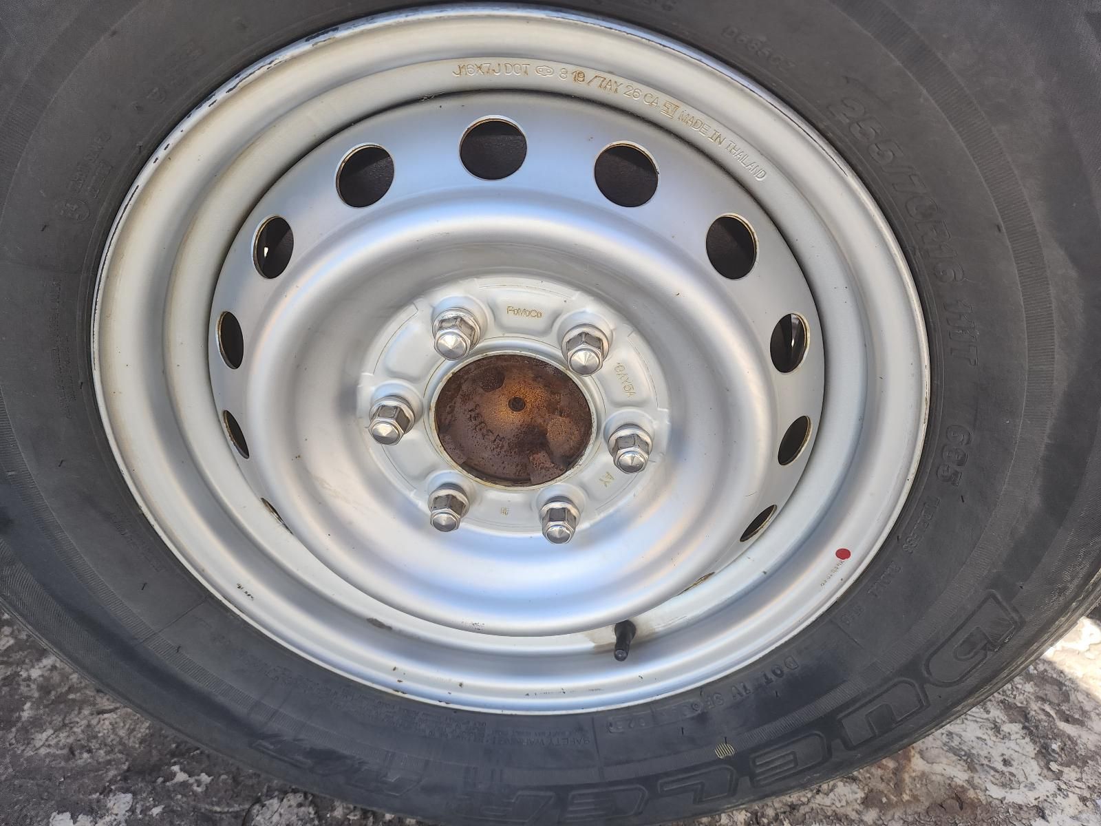 Close-up of a Silver Steel Truck Wheel — South West 4WD Wreckers In Harristown, QLD
