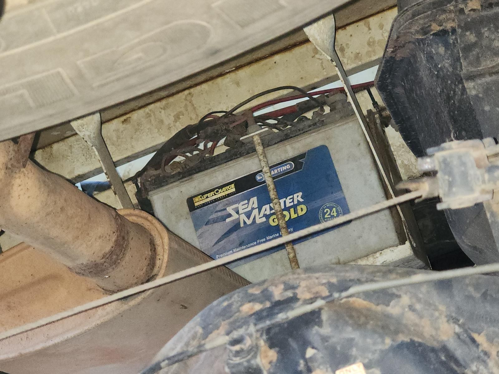 Dirty Blue Battery Mounted Under a Vehicle — South West 4WD Wreckers In Harristown, QLD