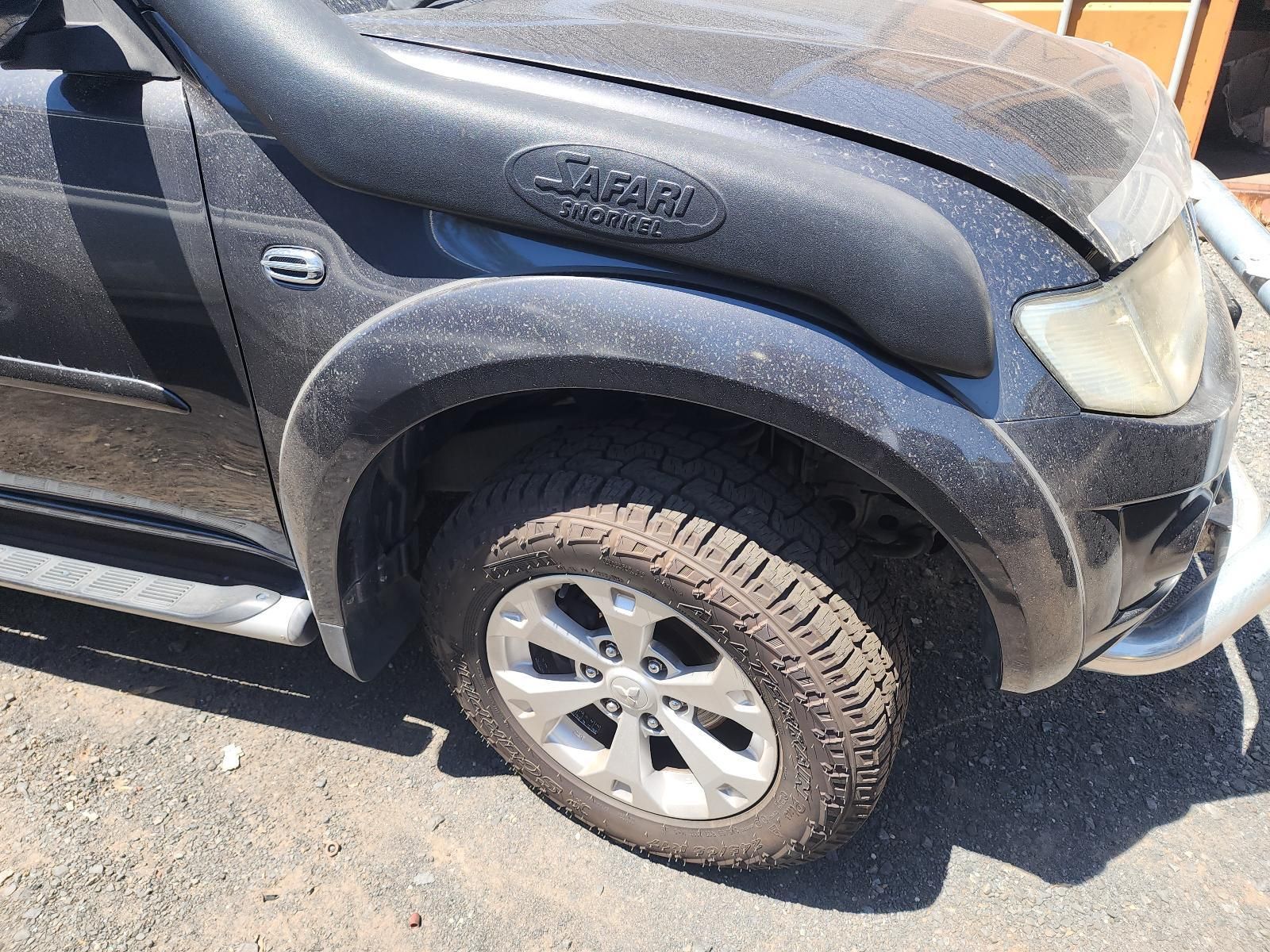 Black Pickup Truck With Scratched Front Fender — South West 4WD Wreckers In Harristown, QLD