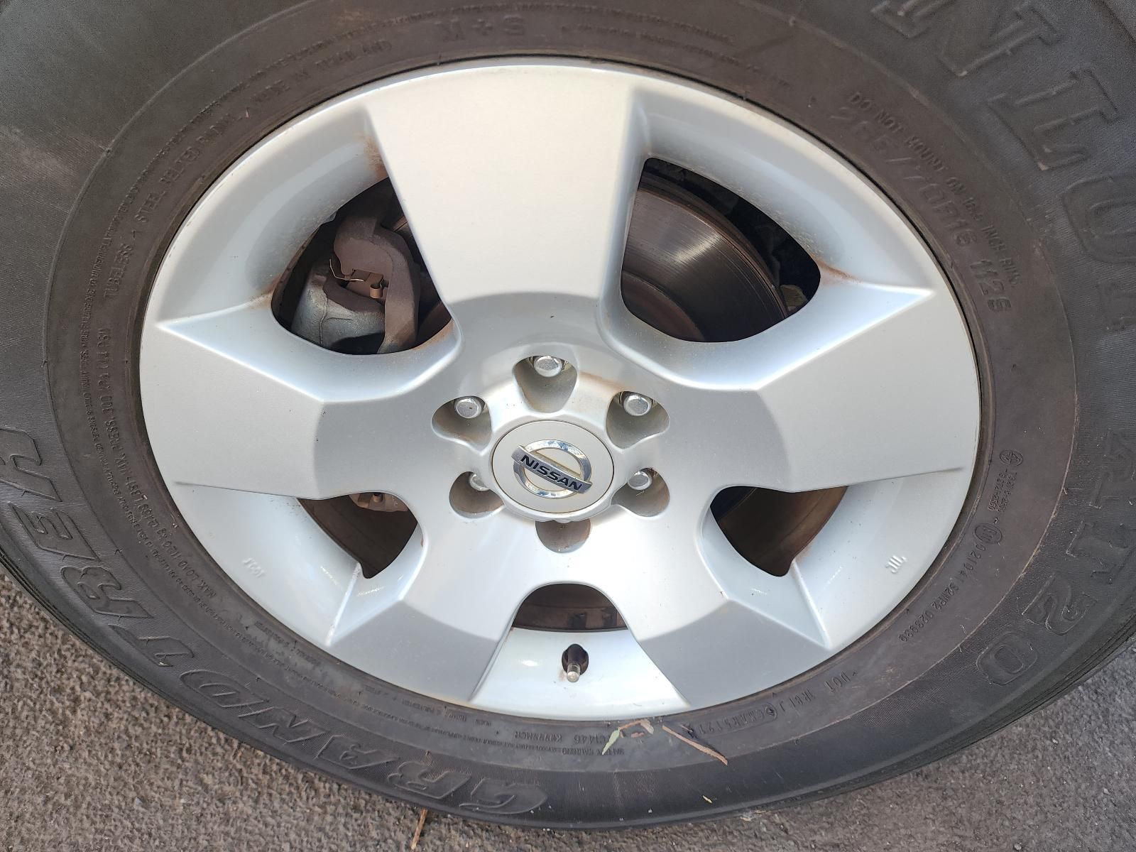 Close-up of a Car Wheel With a Silver Five-spoke Rim — South West 4WD Wreckers In Harristown, QLD