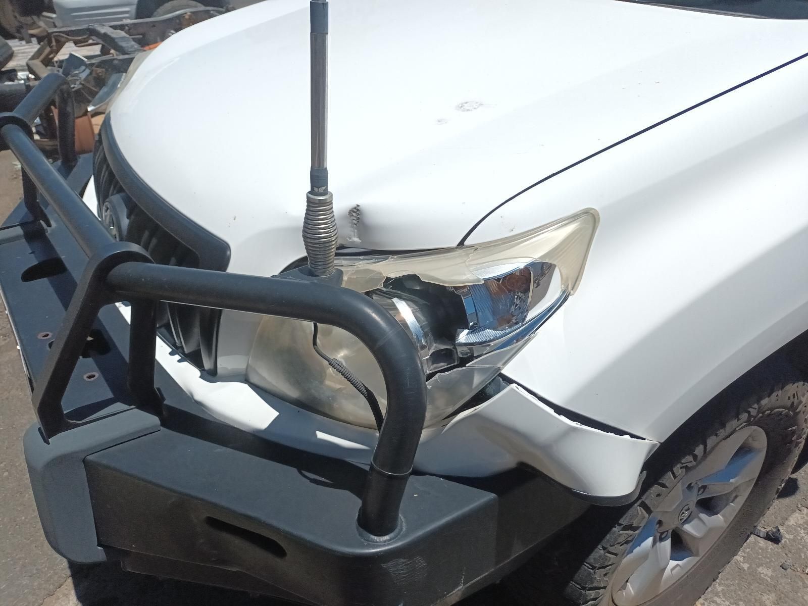 White Suv with Front-End Collision Damage and A Bull Bar in The Foreground — South West 4WD Wreckers In Harristown, QLD