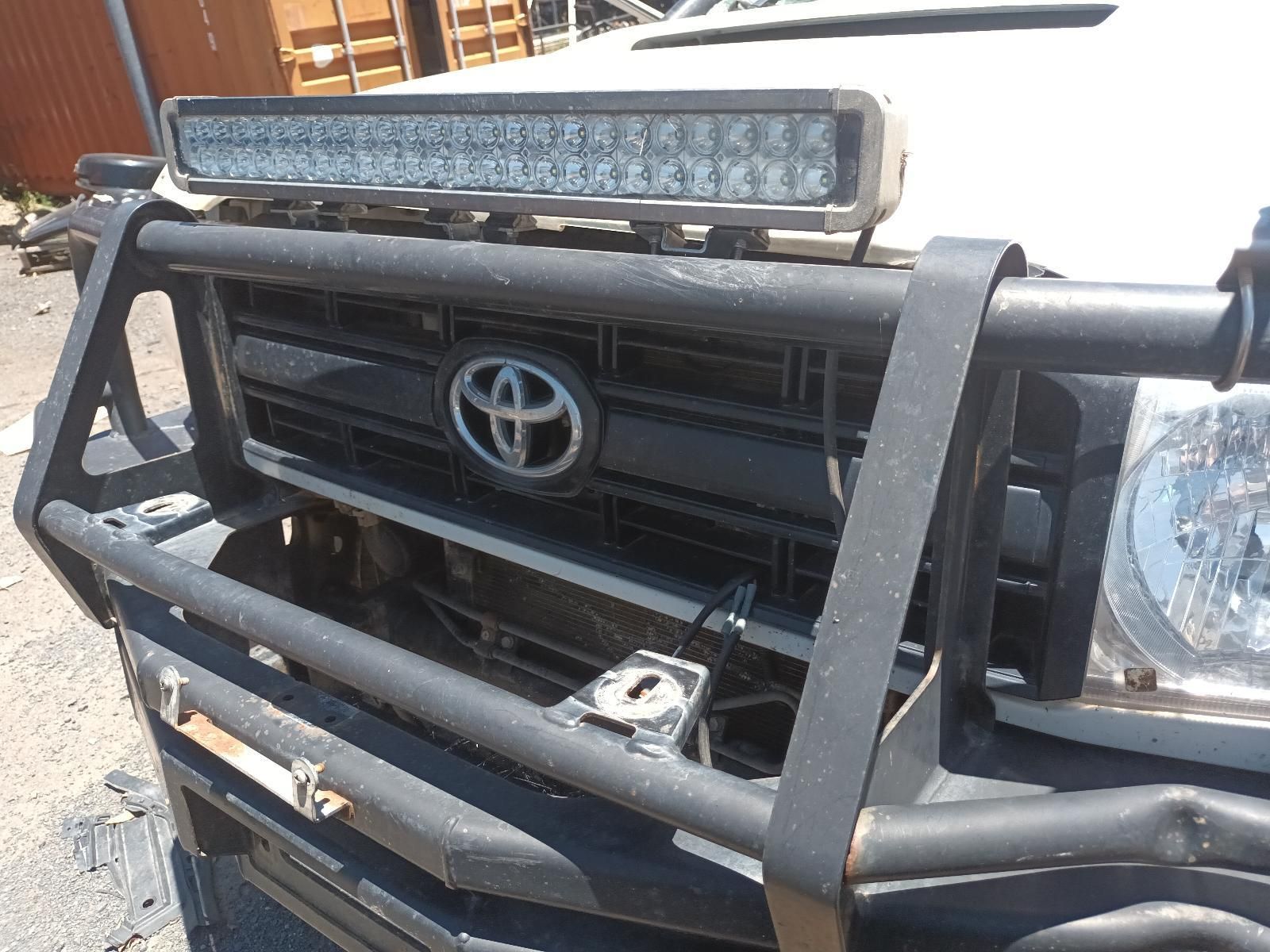 Front View of A Toyota Truck with A Black Bull Bar and Roof Light Bar — South West 4WD Wreckers In Harristown, QLD