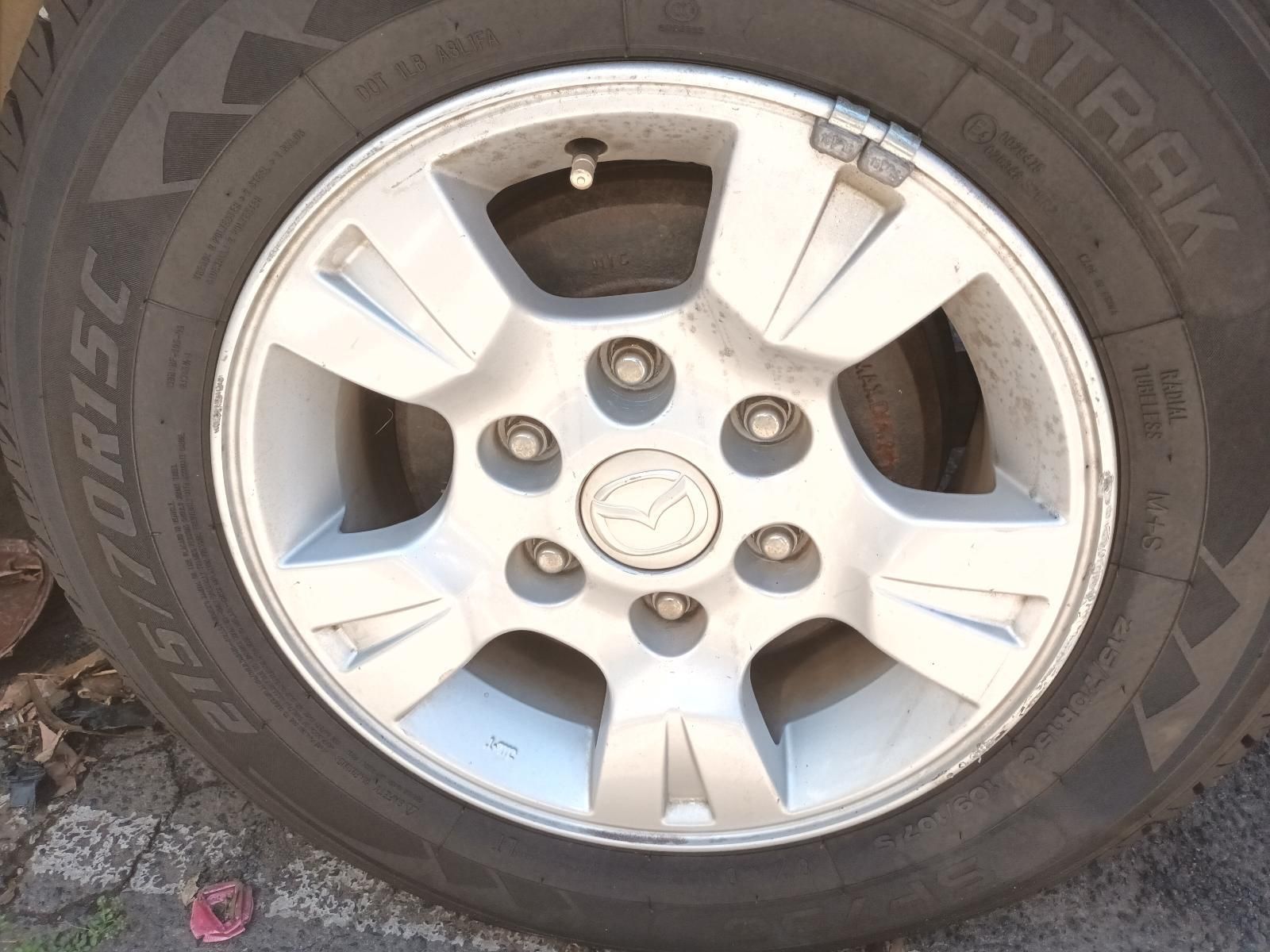 Close-Up of A Silver Alloy Car Wheel with A Black Tyre on A Vehicle — South West 4WD Wreckers In Harristown, QLD